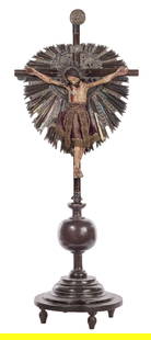 Spanish Colonial Crucifix on Stand: Spanish Colonial Crucifix on Stand A crucifix of wood and gesso on papier mache Santo Christo in two pieces, having a sterling silver heart shaped background and crown of thorns as well as a velvet lo
