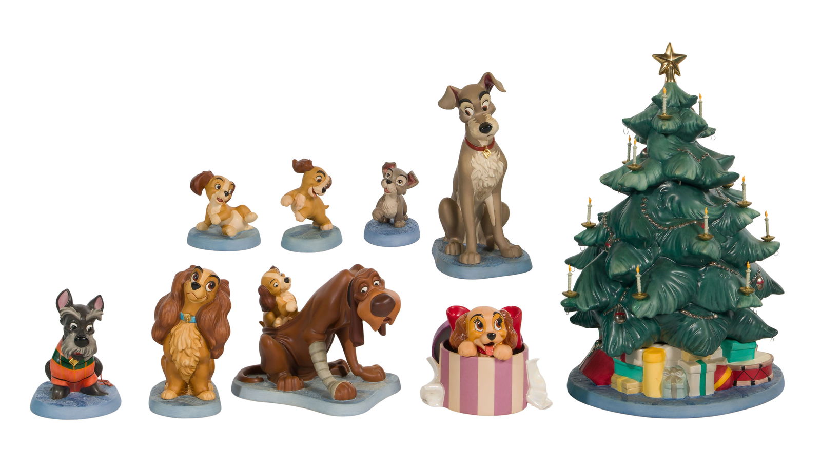 Walt Disney Classics 'Lady and the Tramp' Porcelain Figurines: Walt Disney Classics 'Lady and the Tramp' Porcelain Figurines (9) items including a decorated Christmas tree, Lady, Tramp, Jock, Scamp and pups, all in original boxes, some having COAs Property from:
