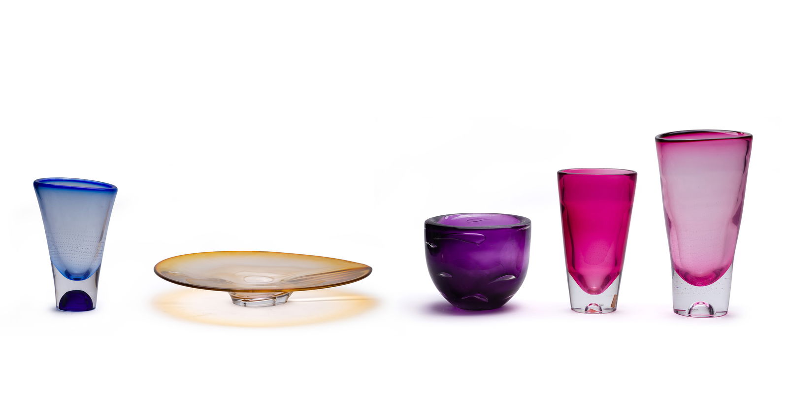 Goran Warff (Swedish, 1933-2022) for Kosta Boda Art Glass Assortment: Goran Warff (Swedish, 1933-2022) for Kosta Boda Art Glass Assortment (5) total items including (2) aubergine vases, a cobalt blue vase (all having rows of controlled bubbles) and a yellow centerpiece,
