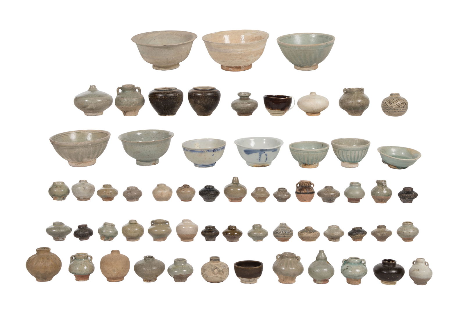 Southeast Asian Thai Sawankhalok Pottery Assortment: Southeast Asian Thai Sawankhalok Pottery Assortment Approximately (60) items including (11) bowls and a variety of jars, some having double handles, all having glazes ranging from pale celadon through