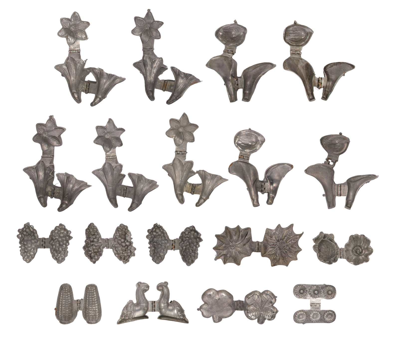 Chocolate and Ice Cream Molds: Chocolate and Ice Cream Molds (18) items including ice cream cones, flowers, grapes, corn and cornucopia, some marked 'E&Co.' for Eppelsheimer & Co Property from: an Estate, Chicago, Illinois Height: 