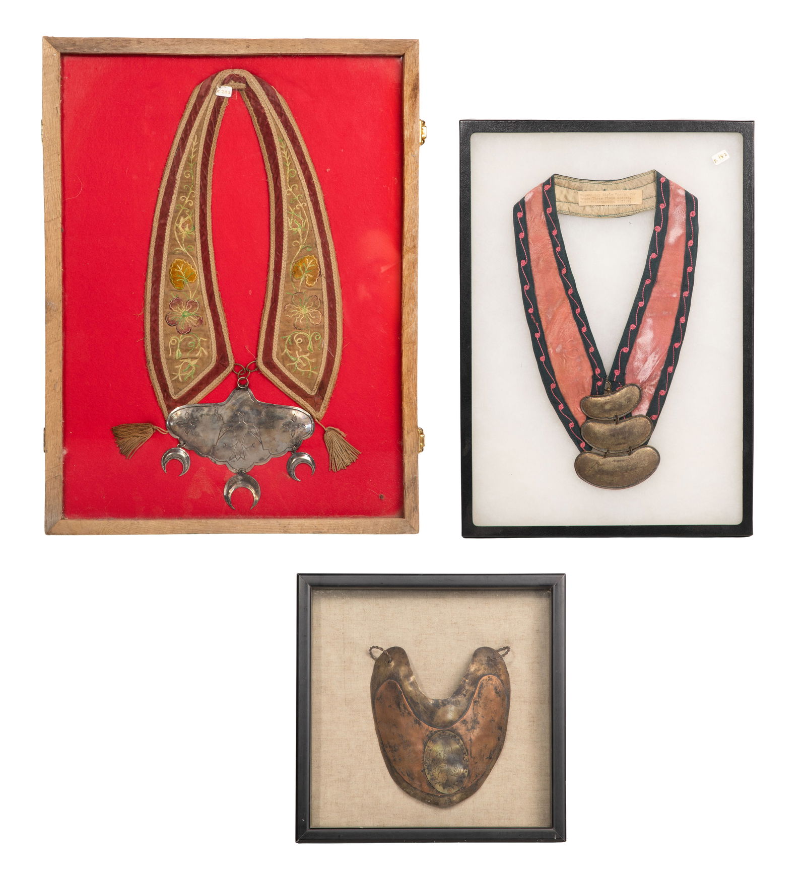 Hudson Bay Indian Trade Gorget Assortment: Hudson Bay Indian Trade Gorget Assortment (3) items including a silver-tone Thunderbird and crescent moon motif on embroidered fabric collar, a three-piece graduated kidney bean form on embroidered fa