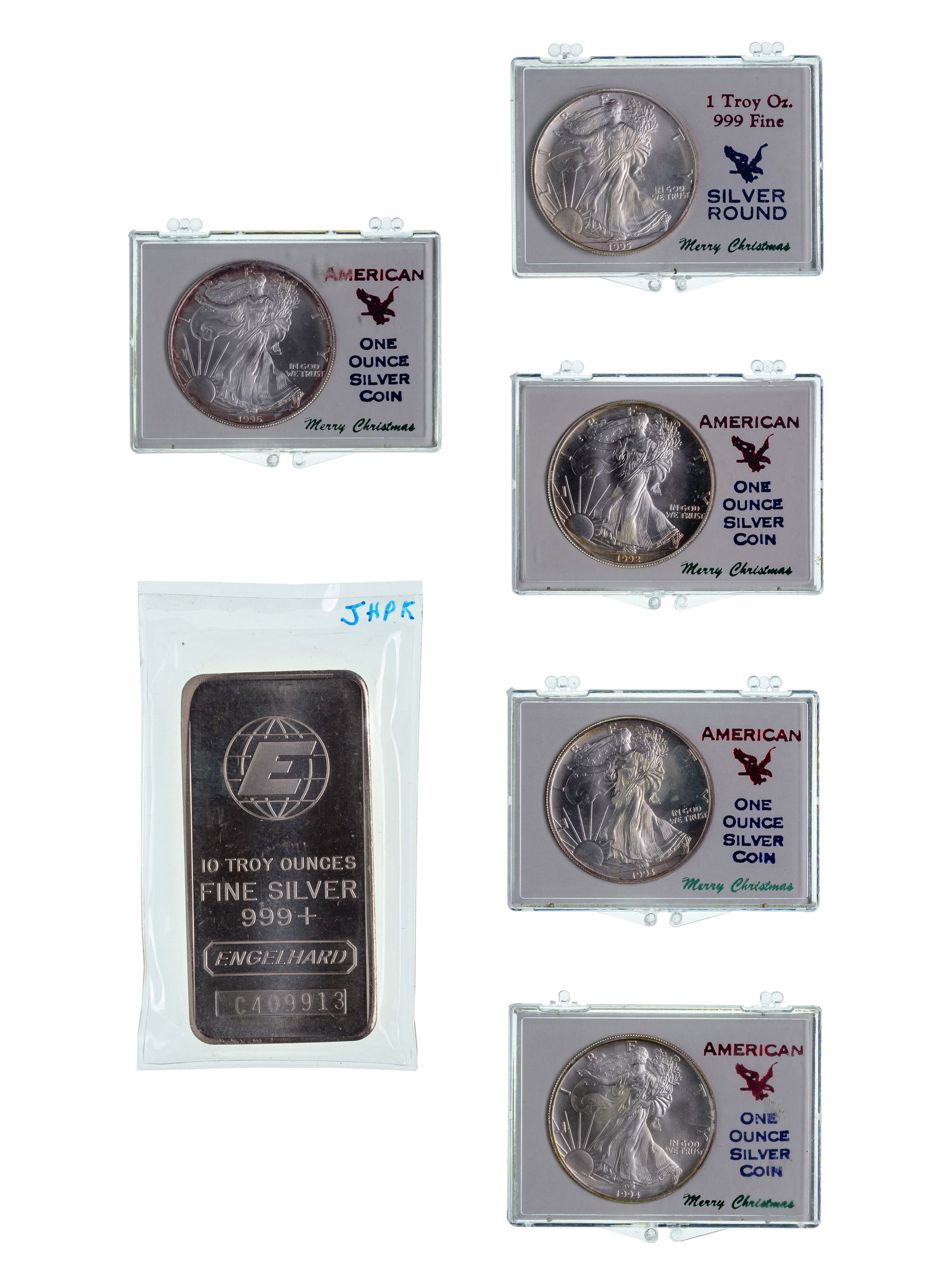Engelhard 10 ozt and (5) Silver Eagle $1 Rounds: Engelhard 10 ozt and (5) Silver Eagle $1 Rounds Fine silver (0.999) including Engelhard #C409913 and Eagles from 1992, 1993, 1994, 1995 and 1996 in Merry Christmas containers (sticker and residue