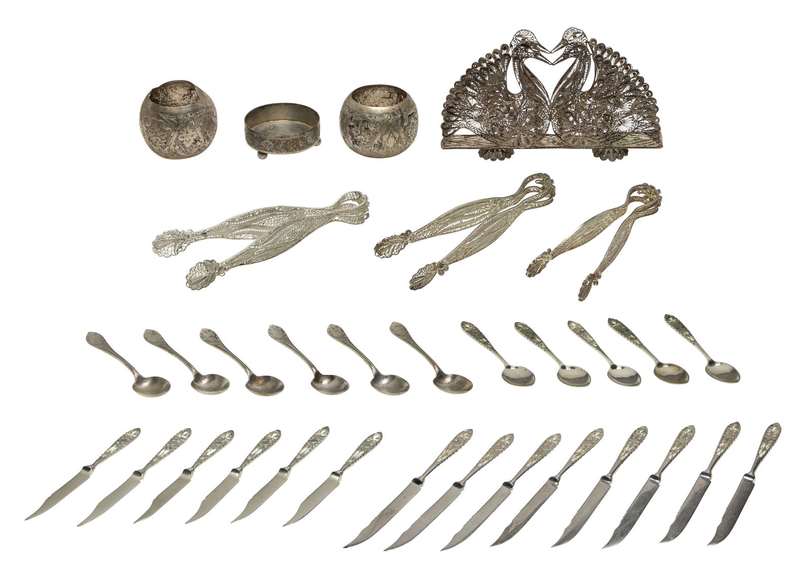 Iranian Silver Assortment: Iranian Silver Assortment (32) total items including a pair of tongs in a storage box, a swan letter holder, (2) pairs of tongs, (2) napkin rings, a salt cellar, (8) knives and (5) spoons (all
