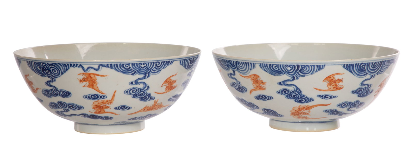Chinese Porcelain Bowls: Chinese Porcelain Bowls A pair having iron red enamel bats amid underglaze blue cloud decoration, both having underglaze blue 6-character Xuantong marks underside Property from: a Private Collector, S