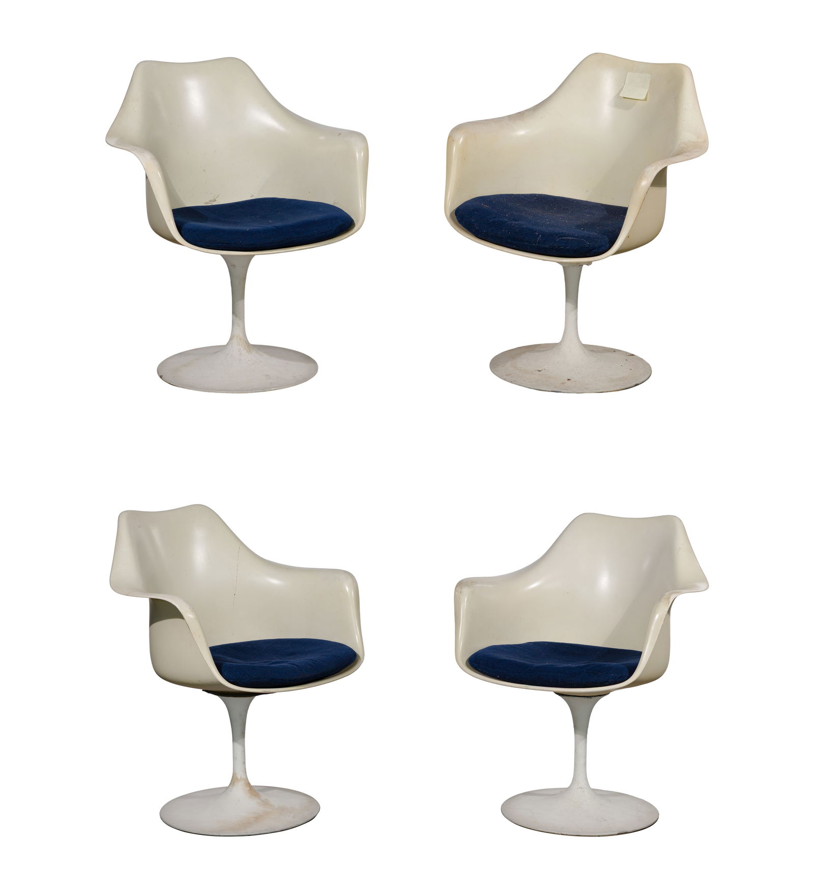 Eero Saarinen for Knoll Tulip Armchairs: Eero Saarinen for Knoll Tulip Armchairs A set of (4) swivel armchairs, molded cream-tone fiberglass seats, set on white-coated aluminum bases stamped, navy fabric upholstered cushions, original