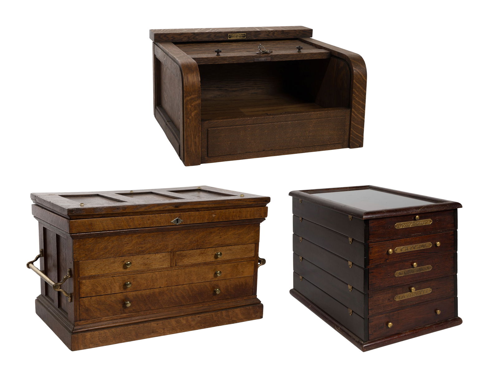 Oak Table Top Cabinet Assortment: Oak Table Top Cabinet Assortment (3) items including a 'McCaskey Register Company' roll top cabinet having key, a mahogany silver counter display having brass name tags of certain patterns and a