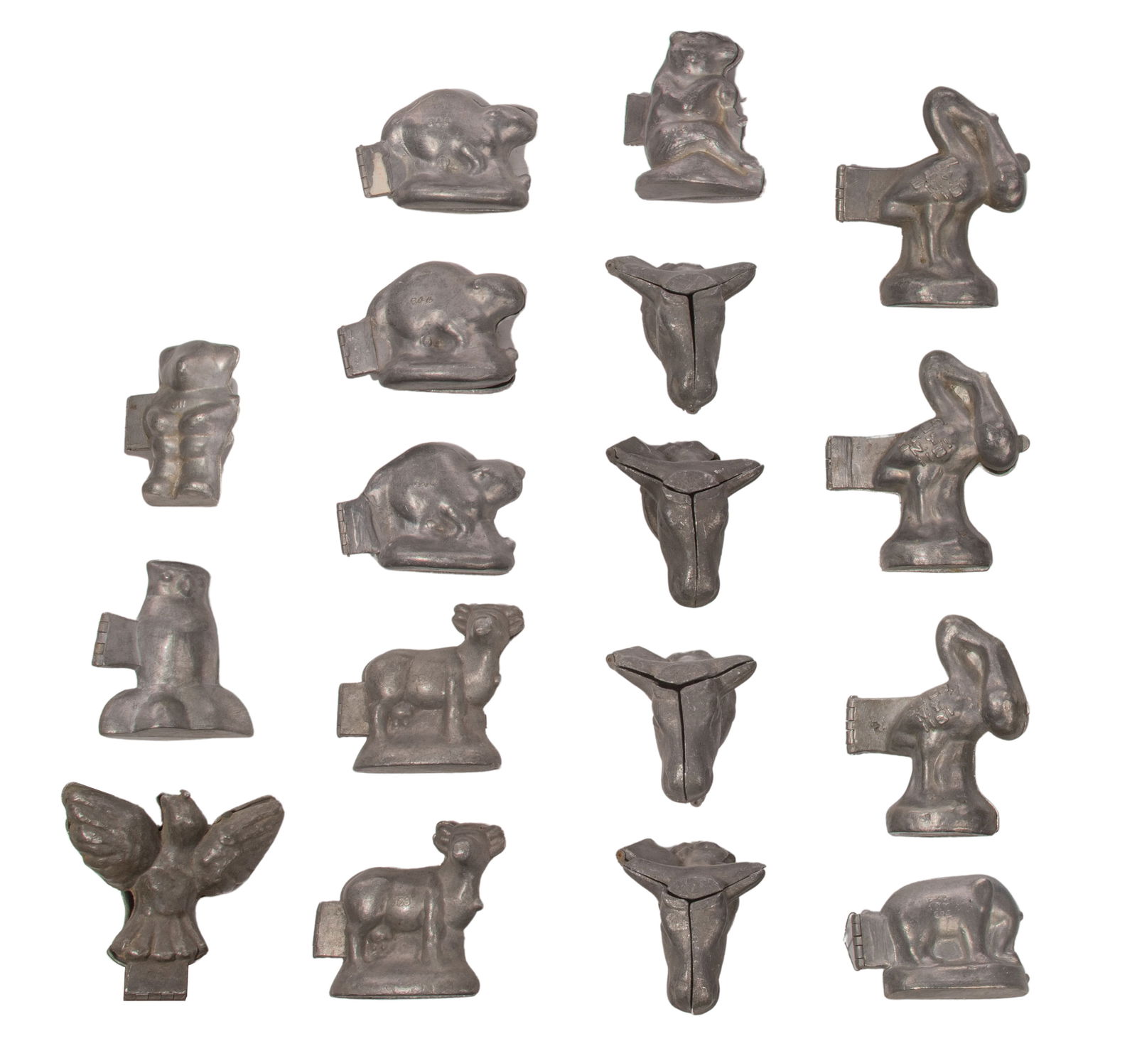 Pewter Animal Form Chocolate and Ice Cream Mold Assortment: Pewter Animal Form Chocolate and Ice Cream Mold Assortment (17) items including cows, beavers, storks with babies, bears, elephant, owl and bird, some marked 'E&Co.' for Eppelsheimer & Co 