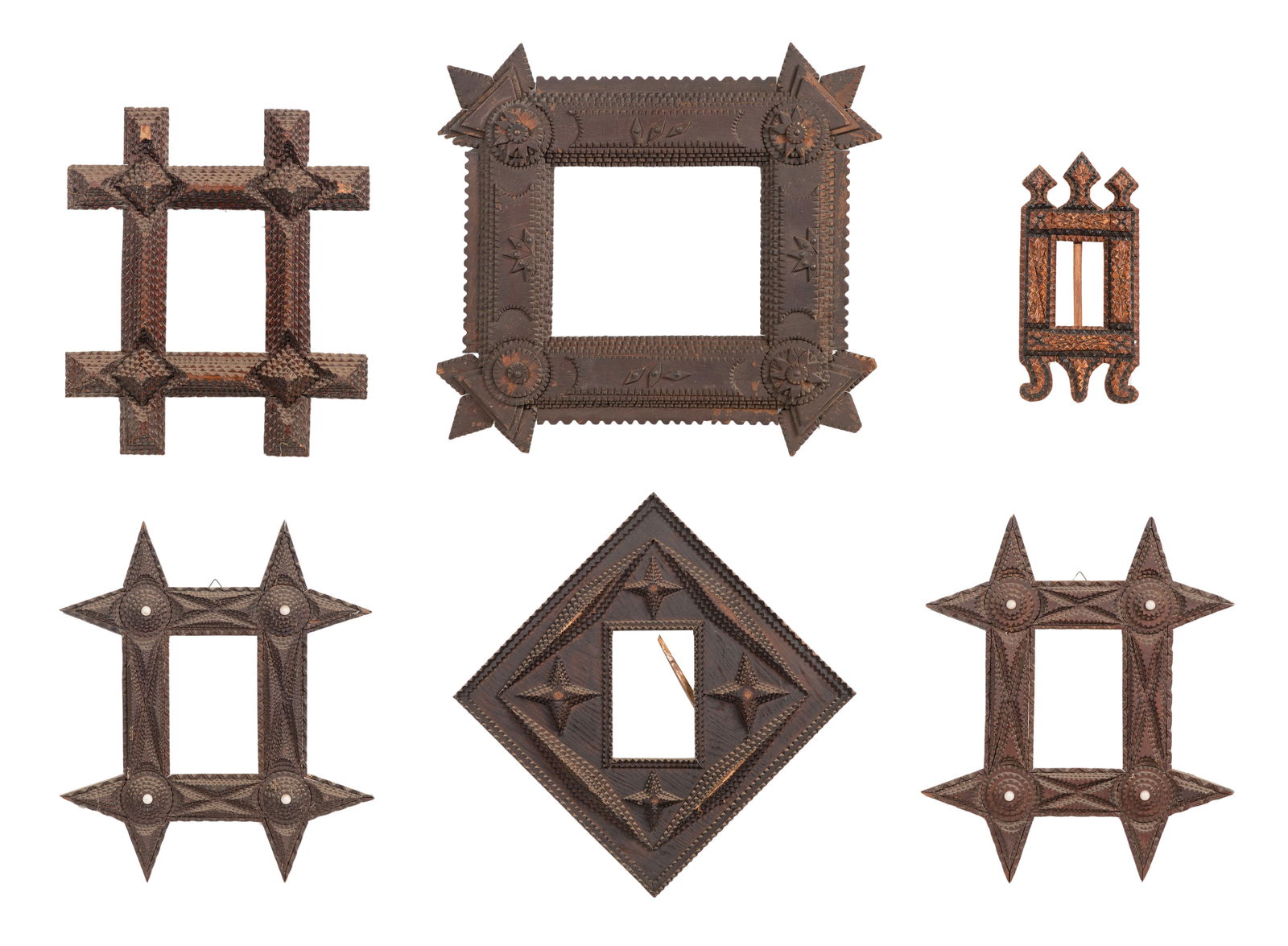 Tramp Art Frame Assortment: Tramp Art Frame Assortment (6) items of various sizes and designs, some having round glass accents, all notch carved by hand Property from: an Estate, Chicago, Illinois Height: 20 inches, Width: 19 in