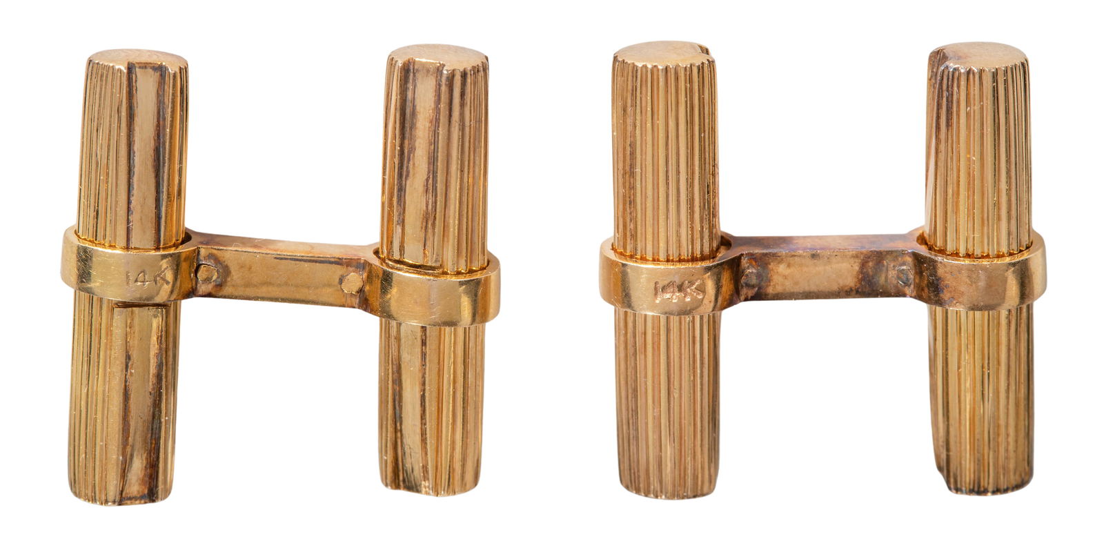 10k Yellow Gold Cufflink Set: 10k Yellow Gold Cufflink Set A pair of ribbed baton style cufflinks (erroneously marked '14k') Property from: a Private Collector, Chicago (Dearborn Park), Illinois Length: 1 inches, Width: