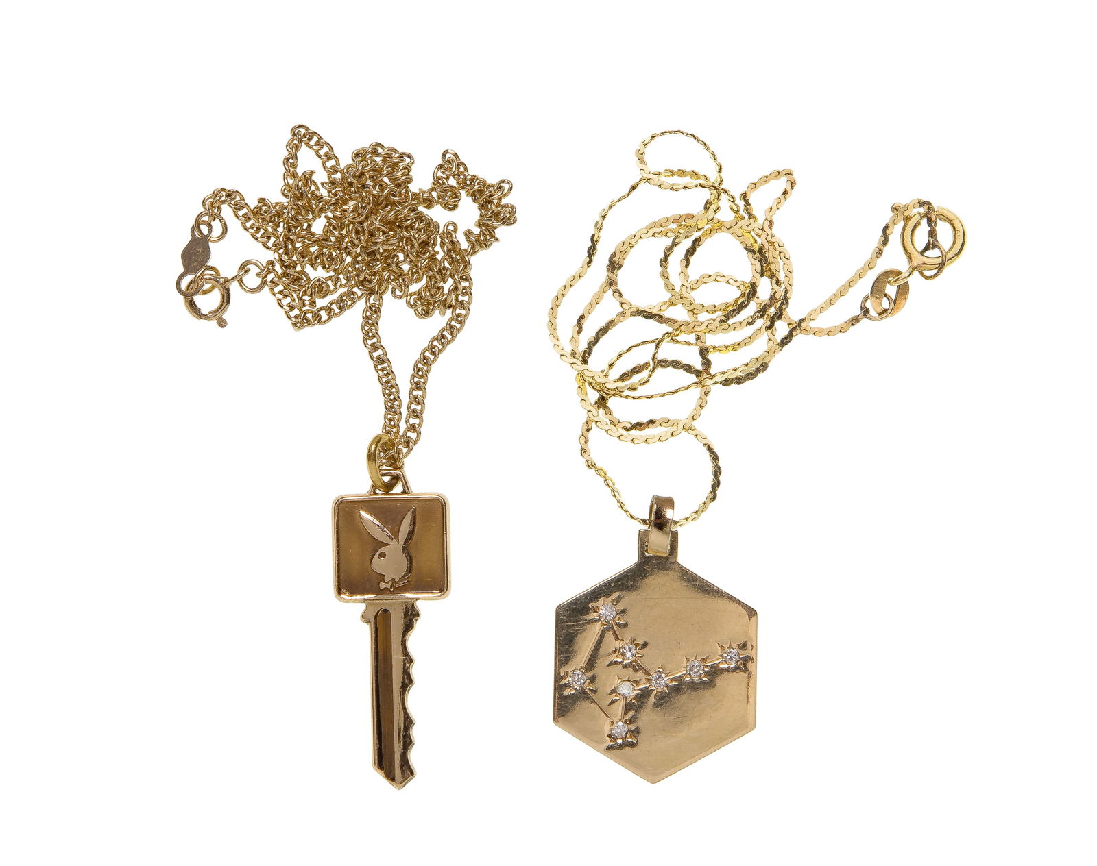 14k Yellow Gold Pendants on Necklaces: 14k Yellow Gold Pendants on Necklaces (2) items including a playboy key and an astrological hexagon having the constellation Virgo in diamond accents (all marked '14k') Property from: a Private