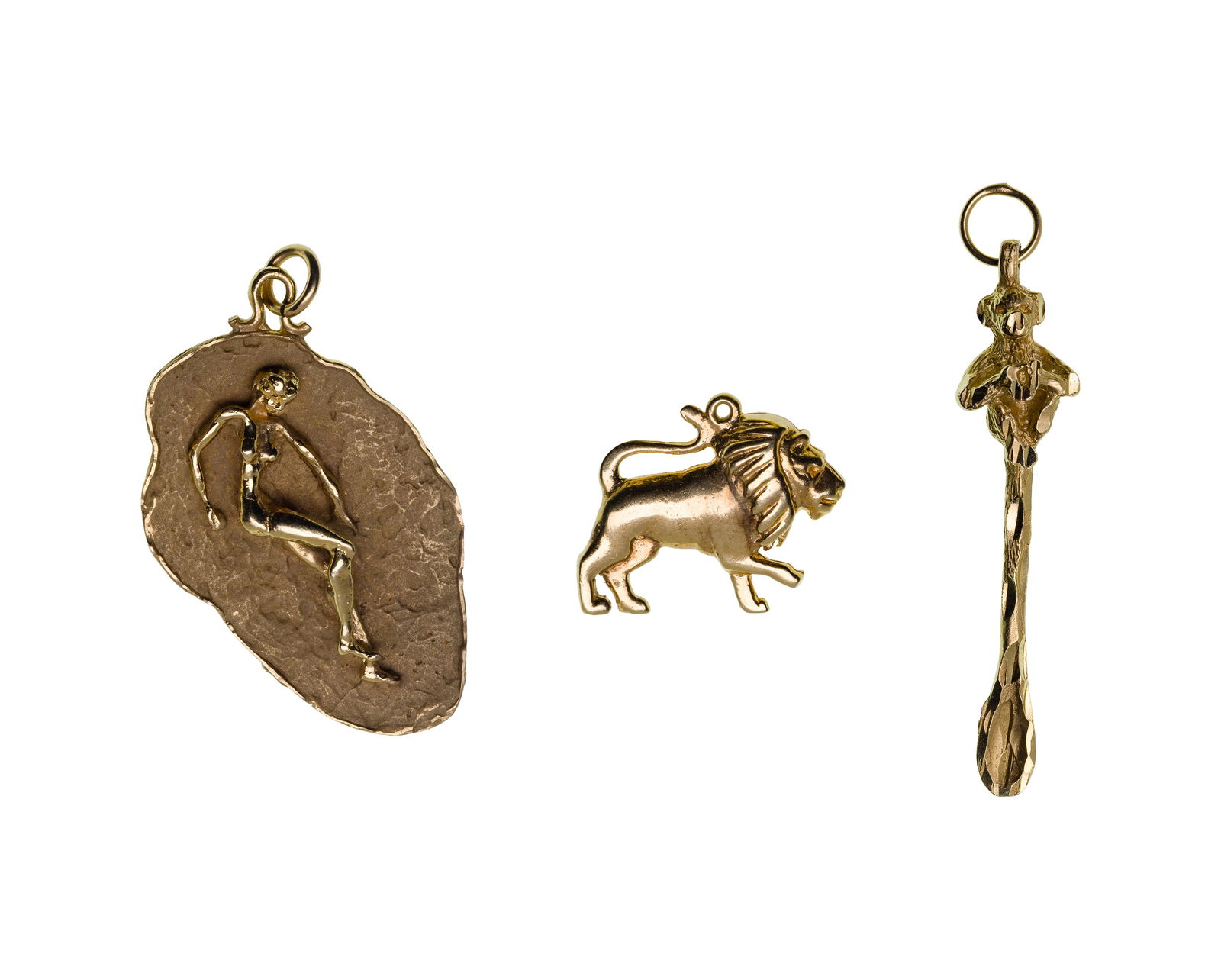 14k Yellow Gold Pendant / Charm Assortment: 14k Yellow Gold Pendant / Charm Assortment (3) items including a lion, a monkey and a figure (unmarked 14k gold) Property from: a Private Collector, Rockford, Ilinois Length: 2 inches,