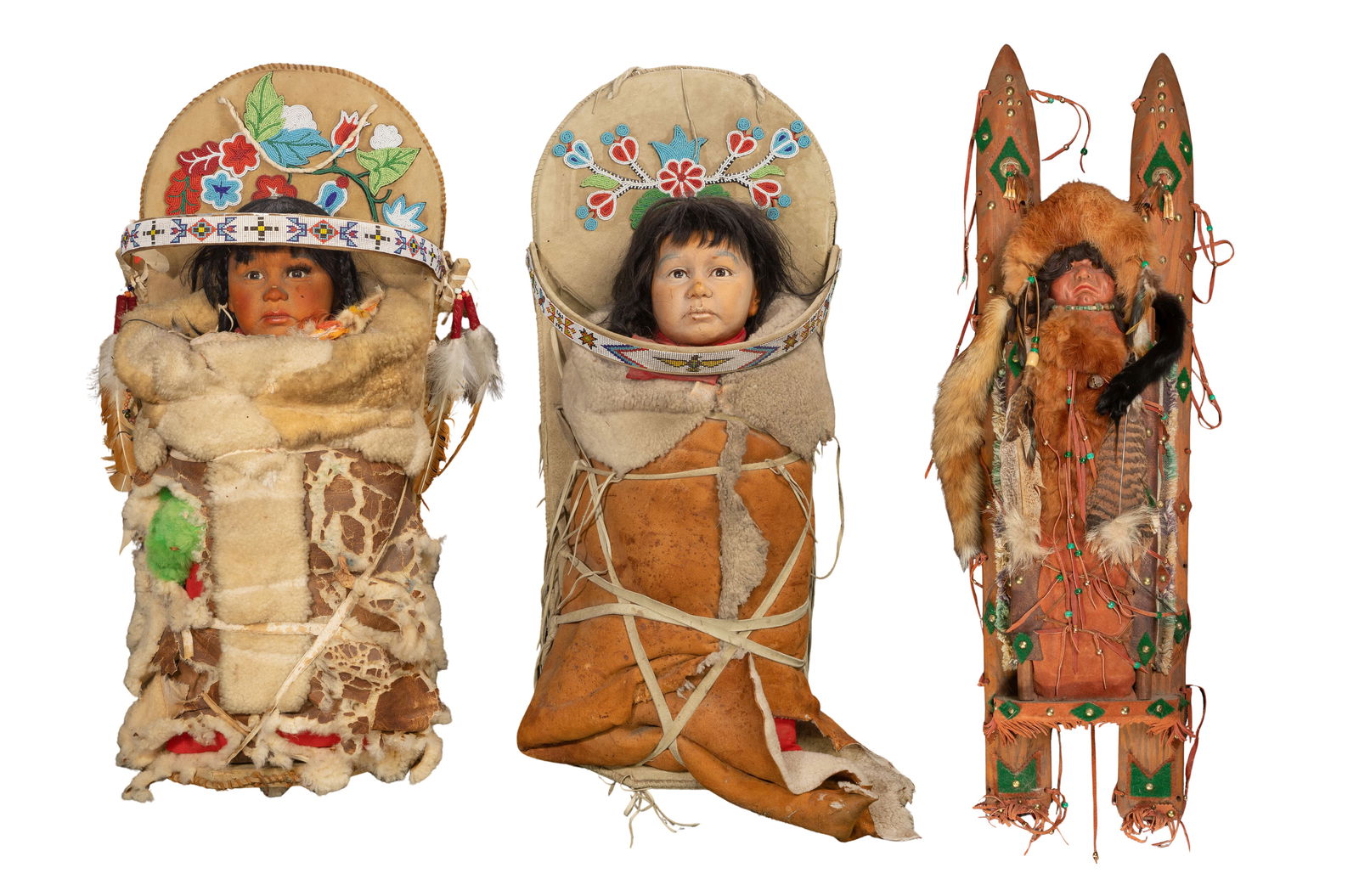 Native American Cradleboard and Doll Assortment: Native American Cradleboard and Doll Assortment (3) items including (2) leather and beaded cradleboards with porcelain dolls wrapped in wool coats as well as a carved wood cradleboard having