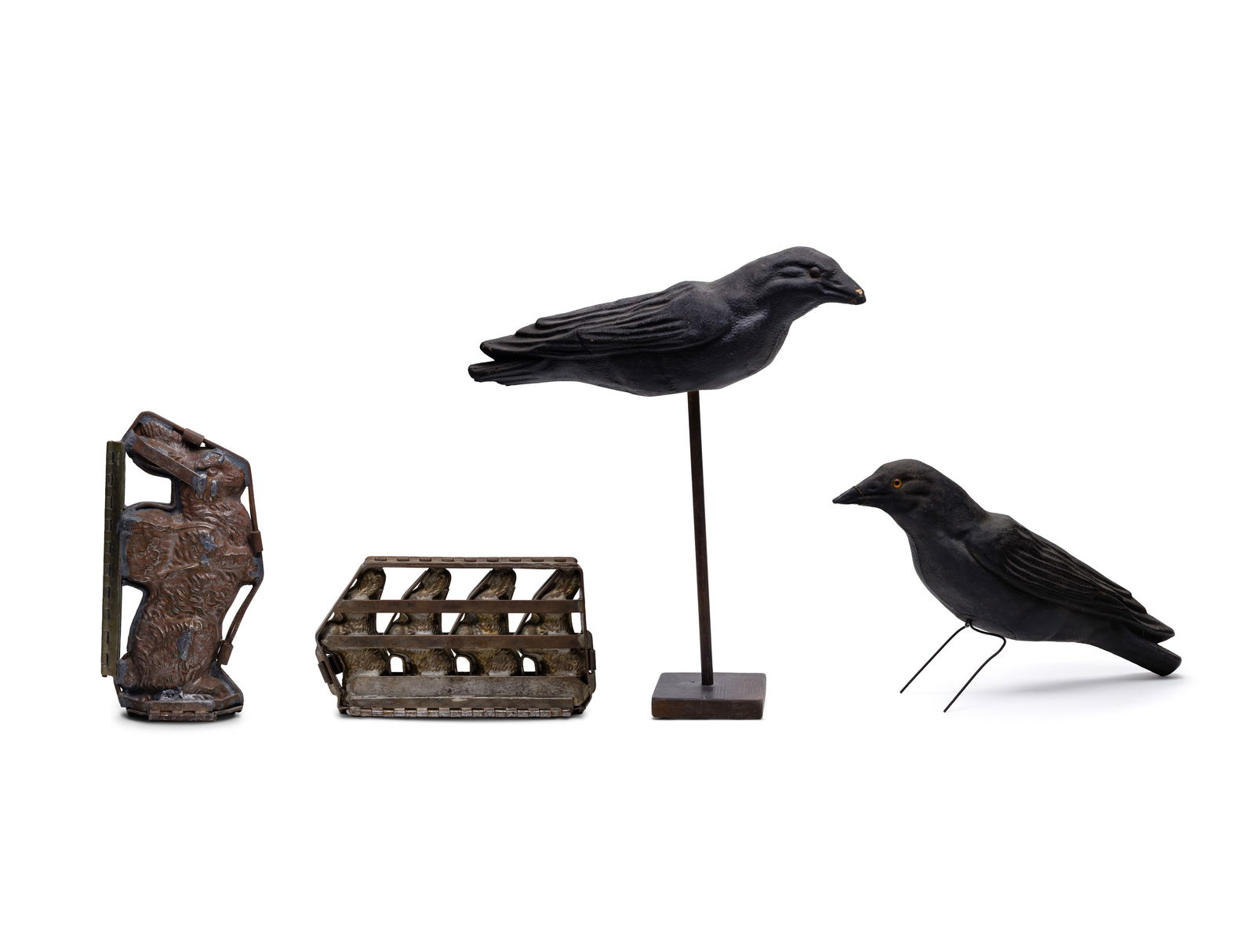 Chocolate Mold and Raven Decoy Assortment: Chocolate Mold and Raven Decoy Assortment (4) items including (2) hinged metal Easter Bunny molds and (2) mold-formed composition ravens Property from: a Private Collector, Glenview, Illinois 