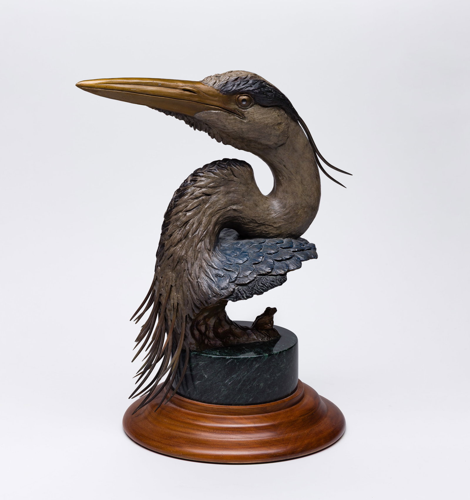 David H. Turner (American, b.1961) Bronze Heron Sculpture: David H. Turner (American, b.1961) Bronze Heron Sculpture 1991, signed, #42/100, cold painted head of a great blue heron and a frog, set on a hard stone and wood base Property from: an Estate,
