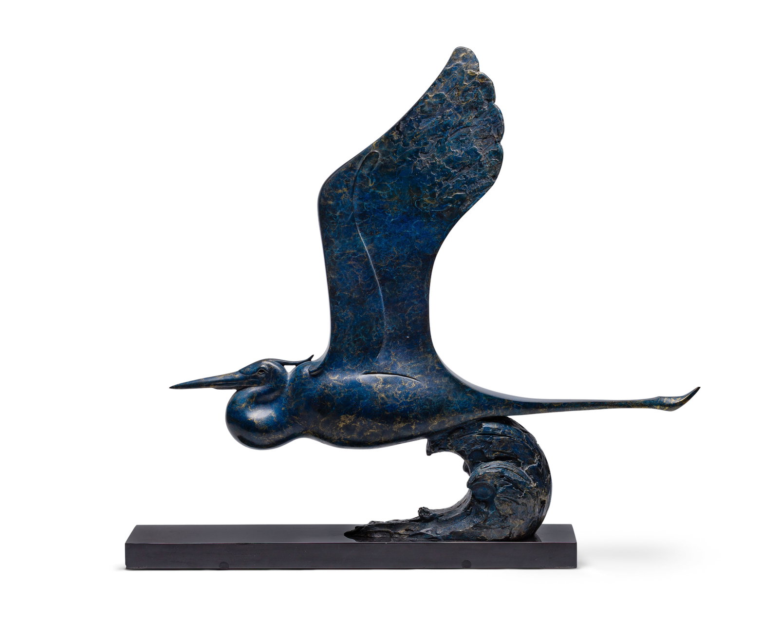 Tim Cherry (Canadian, b.1965) Bronze Heron Sculpture: Tim Cherry (Canadian, b.1965) Bronze Heron Sculpture Undated, signed, #AP/10, depicting a blue heron in flight over a wave set on a black hard stone plinth Property from: an Estate, Madison,