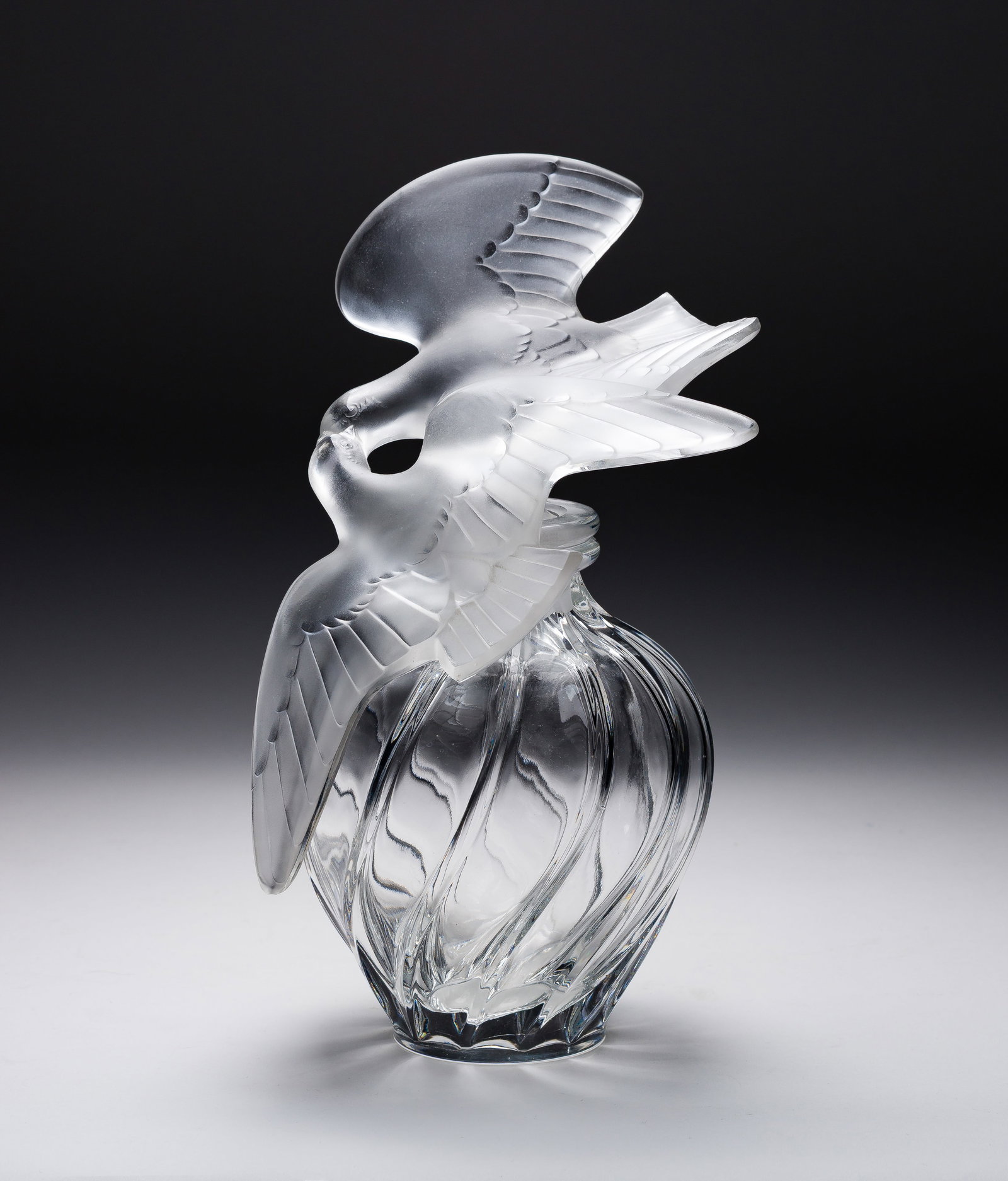 Lalique Crystal L'Air du Temp Display Factice: Lalique Crystal L'Air du Temp Display Factice Having a dual frosted and clear conjoined doves stopper with twisted clear crystal body, marked on lower rim of bottle Property from: a Private
