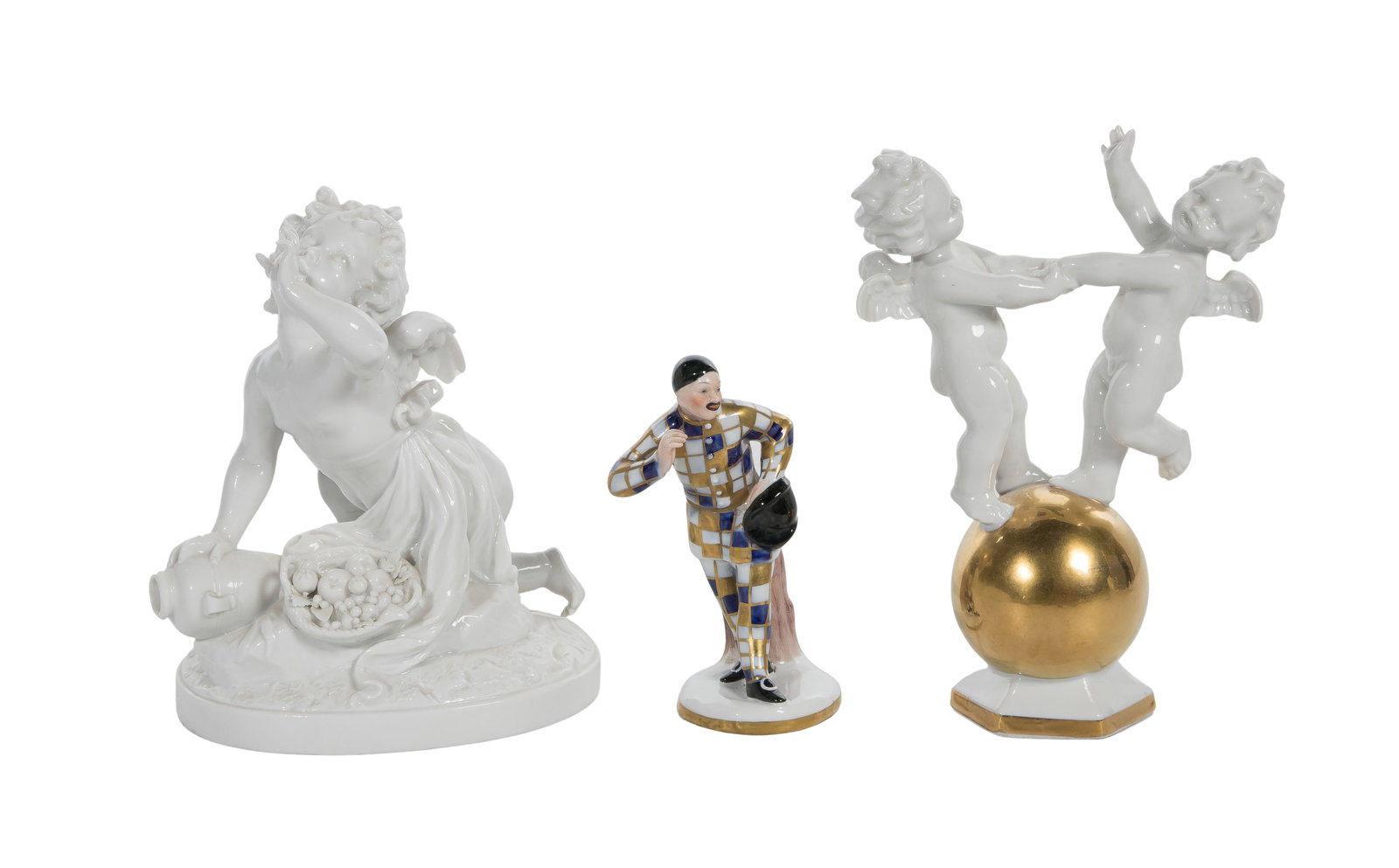 European Porcelain Figurine Assortment: European Porcelain Figurine Assortment (3) items including a Porzellanfabrik Carl Scheidig depiction of two putti dancing on a gilt globe, marked underside, a marked Capodimonte harlequin-like