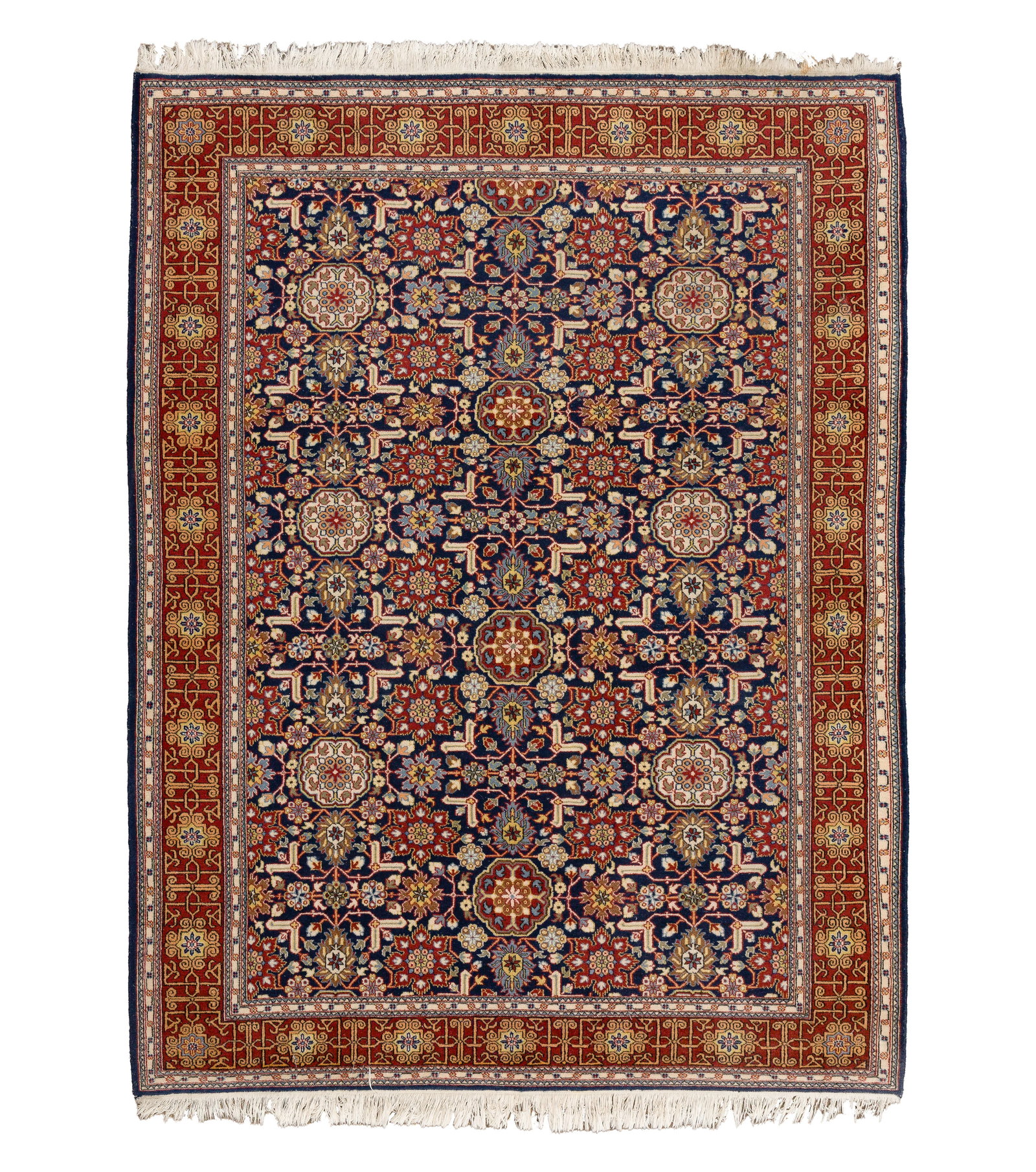 Persian Wool Rug: Persian Wool Rug Hand woven having an abstract geometric and floral design in hues of cream, red, gold and blue on a blue field Property from: an Estate, Chicago (Wrigleyville), Illinois Rug