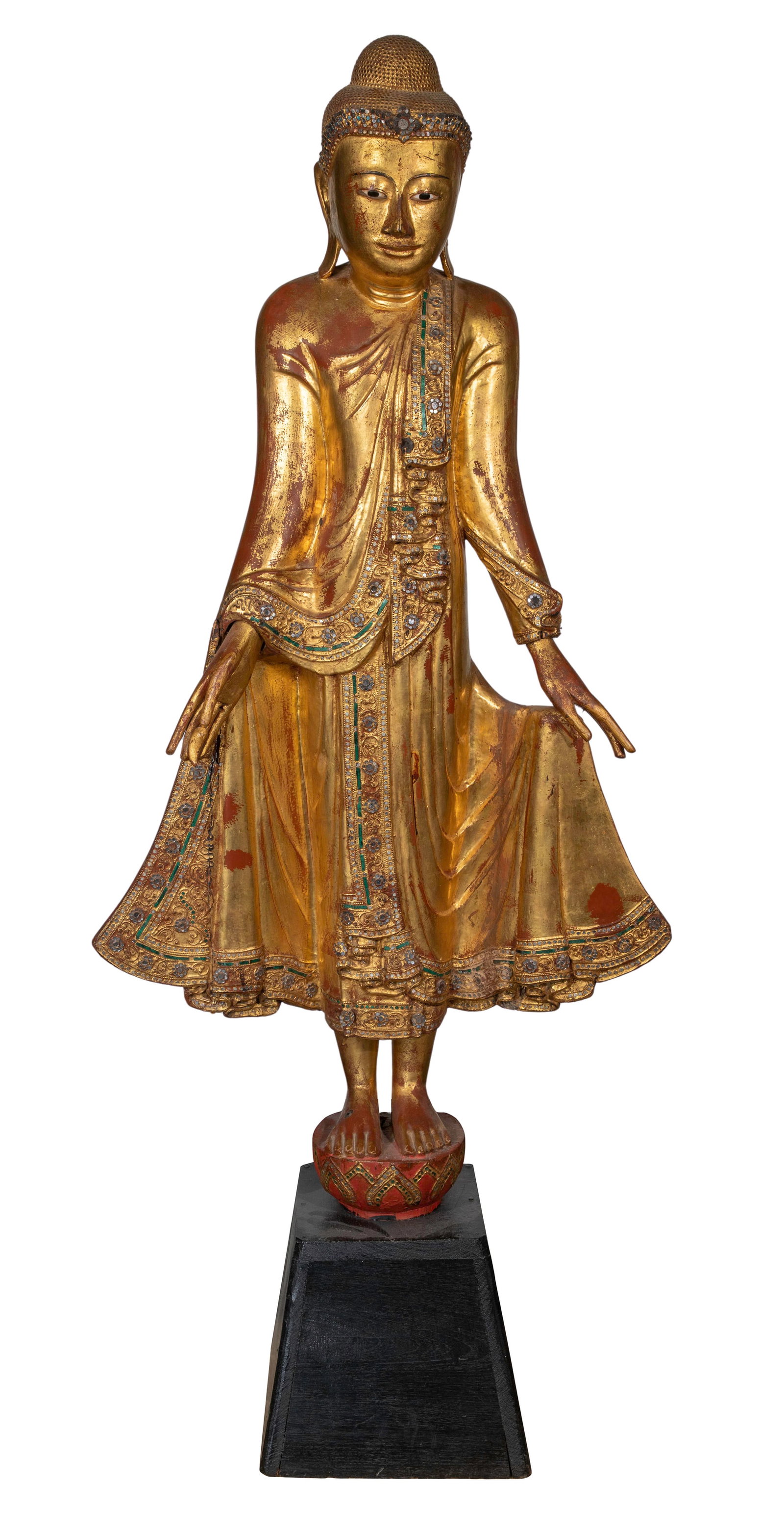 Burmese Gilt Wood Buddha Statue: Burmese Gilt Wood Buddha Statue Mandalay style gilt lacquered wood having colored glass inlays, on integral base mounted on a wood pedestal base Property from: a Private Collector, Evanston,