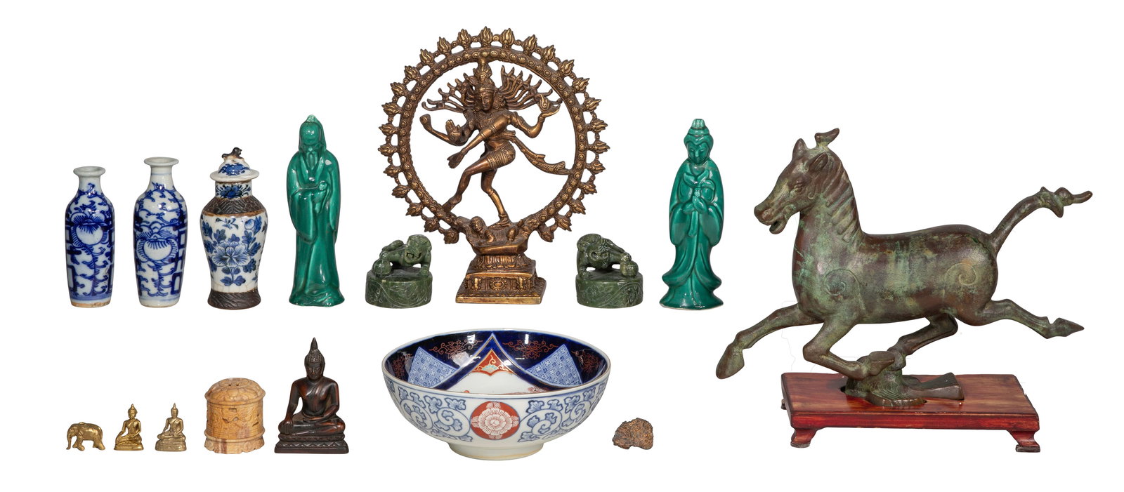 Asian Decorative Object Assortment: Asian Decorative Object Assortment (16) items including a bronze-tone metal horse sculpture on wood stand, a brass Shiva icon, an Imari style porcelain bowl, a green glaze statue set, a set of