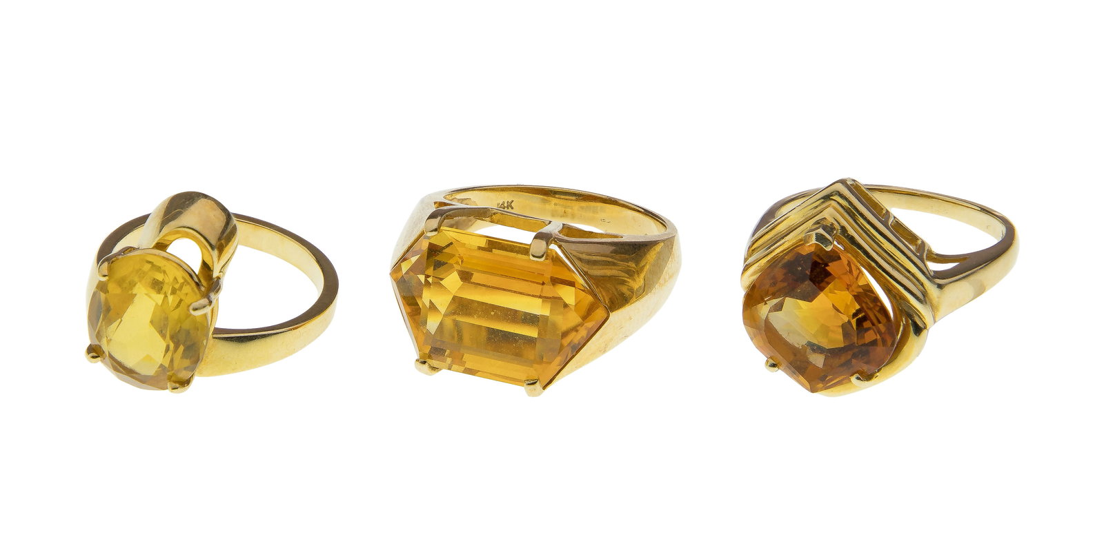 14k Yellow Gold and Citrine Ring Assortment: 14k Yellow Gold and Citrine Ring Assortment (3) items including an approximately 18 x 12mm hexagonal cut citrine in a horizontal layout, an approximately 13 x 12mm rounded cut citrine