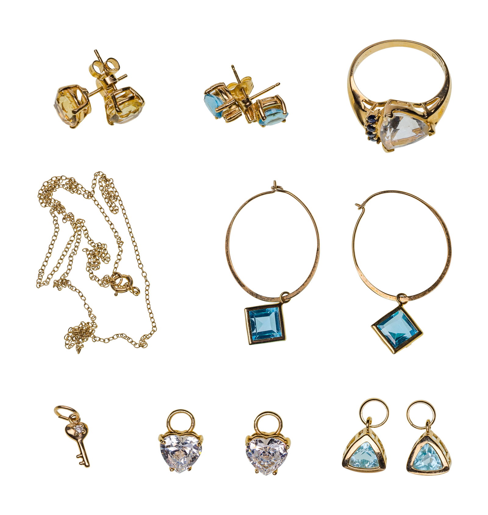 14k Yellow Gold and Gemstone Jewelry Assortment: 14k Yellow Gold and Gemstone Jewelry Assortment (8) items including (3) pairs of pierced earrings, (2) pairs of earring jackets, a trillion cut gemstone ring, a key pendant and a fine chain necklace (