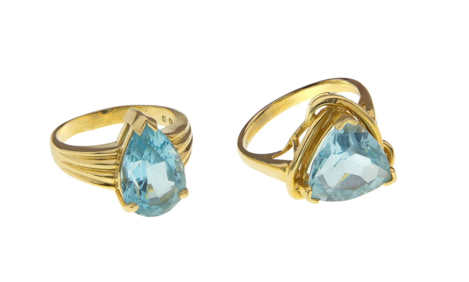 14k Yellow Gold and Blue Topaz Rings: 14k Yellow Gold and Blue Topaz Rings (2) cocktail rings including an approximately 14mm x 10mm pear cut and an approximately 11mm x 11mm trillion cut (all marked '14k') Property from: a Private Collec