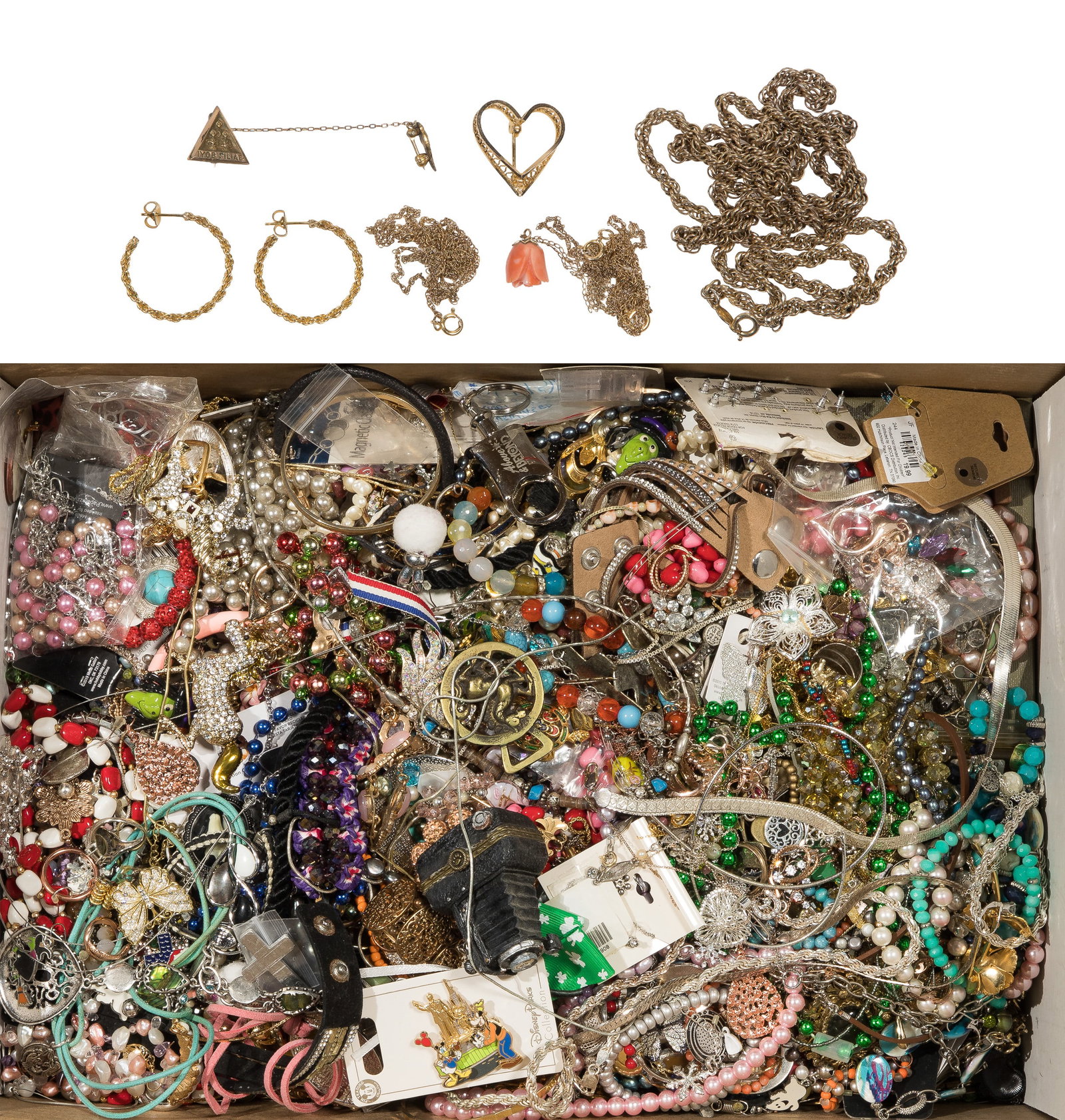 Costume Jewelry Assortment: Costume Jewelry Assortment Approximately (19) pounds of necklaces, pendants, bracelets, pins, rings, earrings and (2) floral themed heart-shape jewelry trinket dishes Property from: an Estate,