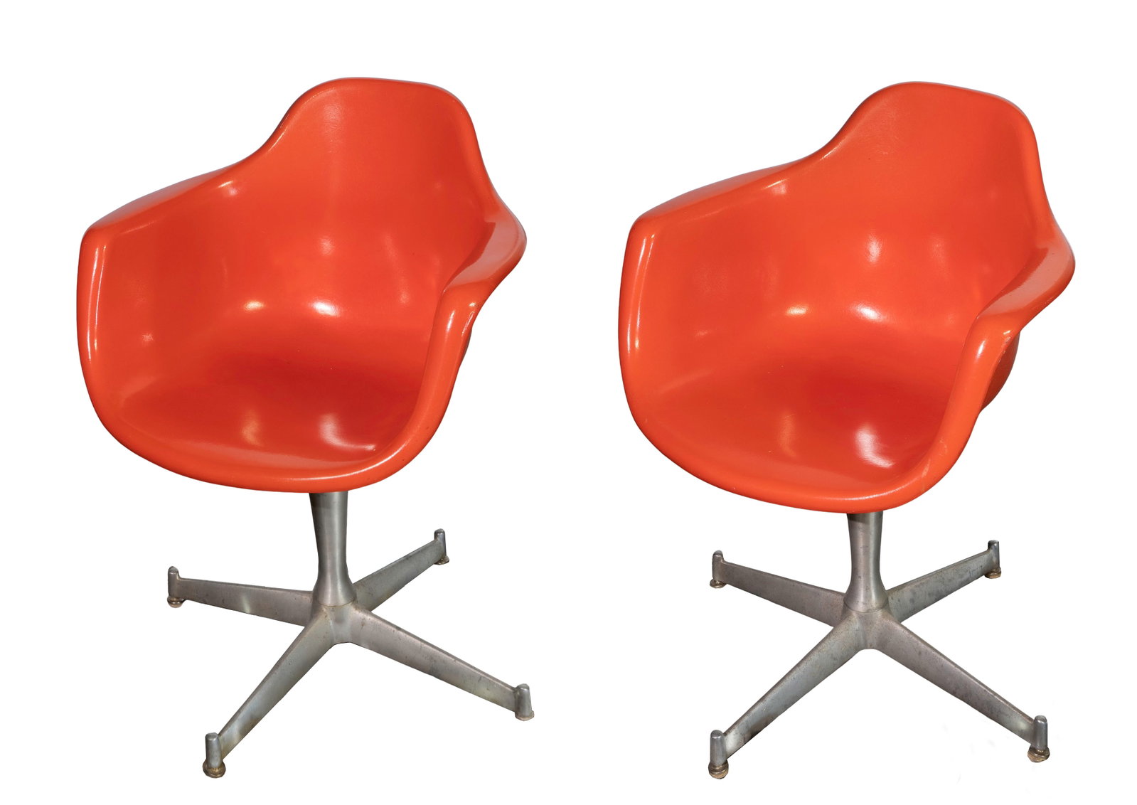 Krueger Fiberglass Shell Chairs: Krueger Fiberglass Shell Chairs A pair of molded fiberglass shell bucket chairs mounted on swivel chrome bases, in the atomic orange color, imprinted 'Krueger Metal Products' on the underside
