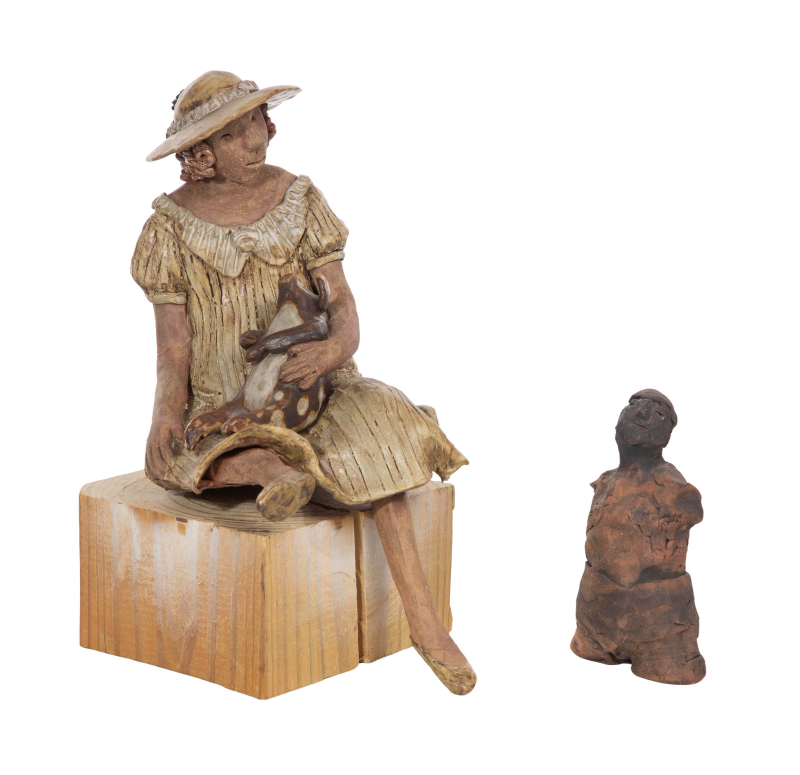 Sandra McKenzie Schmitt (American, 20th Century) Pottery Sculpture: Sandra McKenzie Schmitt (American, 20th Century) Pottery Sculpture (2) items including a depiction of a seated woman cradling a pig, on a wood base, signed underside and an unsigned armless figure