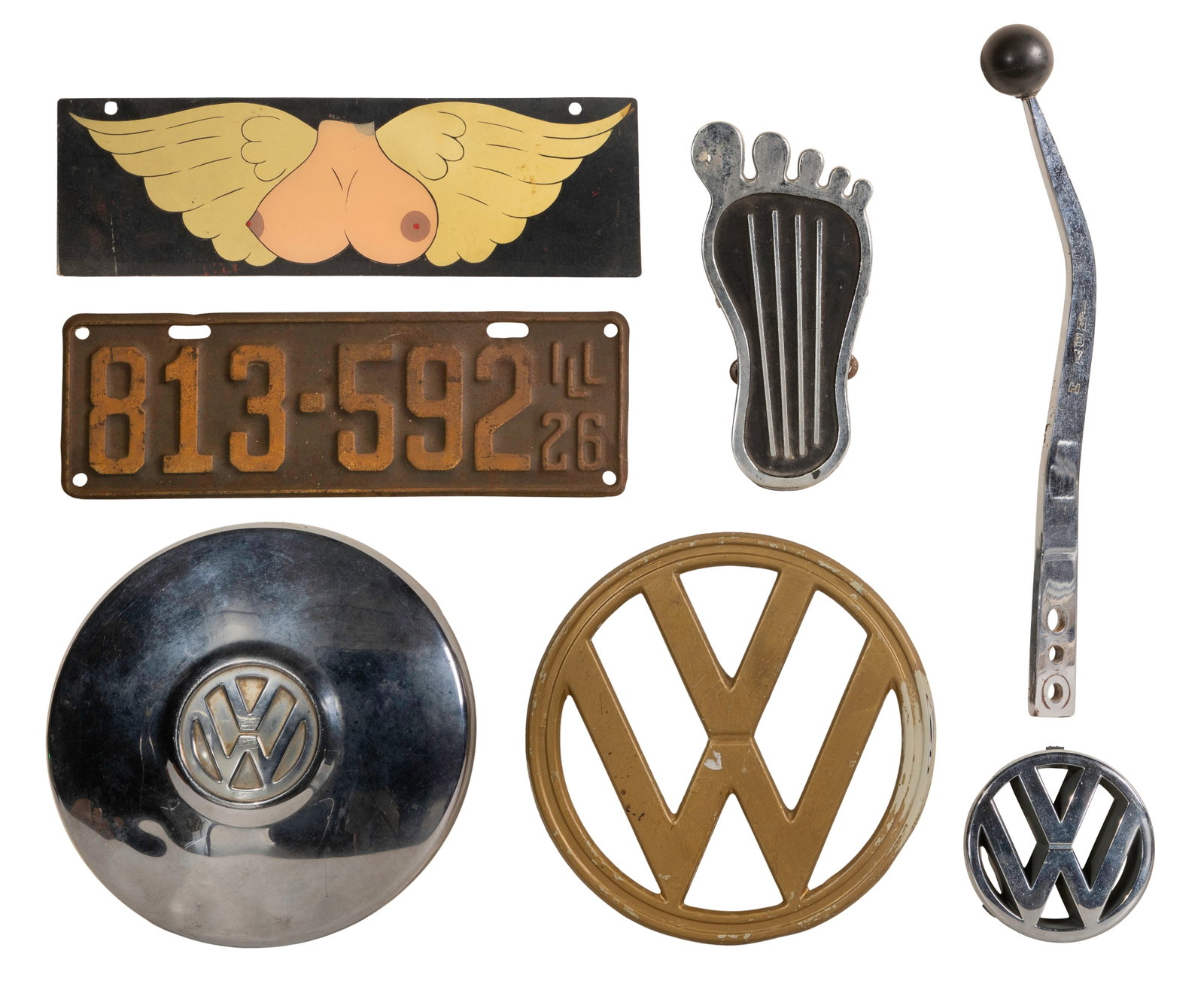 Volkswagen and Automobile Accessory Assortment: Volkswagen and Automobile Accessory Assortment (6) items including a nose plate from a mid-century VW bus as well as (2) VW logo hub caps, a Cal-Custom surfer barefoot gas throttle, a gear shift