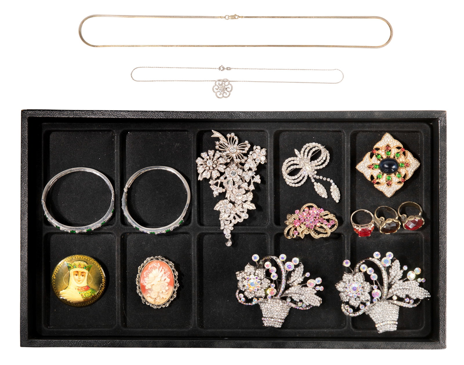 Gold, Sterling Silver, Rhinestone and Costume Jewelry Assortment: Gold, Sterling Silver, Rhinestone and Costume Jewelry Assortment (16) items including a pendant necklace having a center diamond halo surrounded by a diamond accented swirl design (marked '14k'), a li