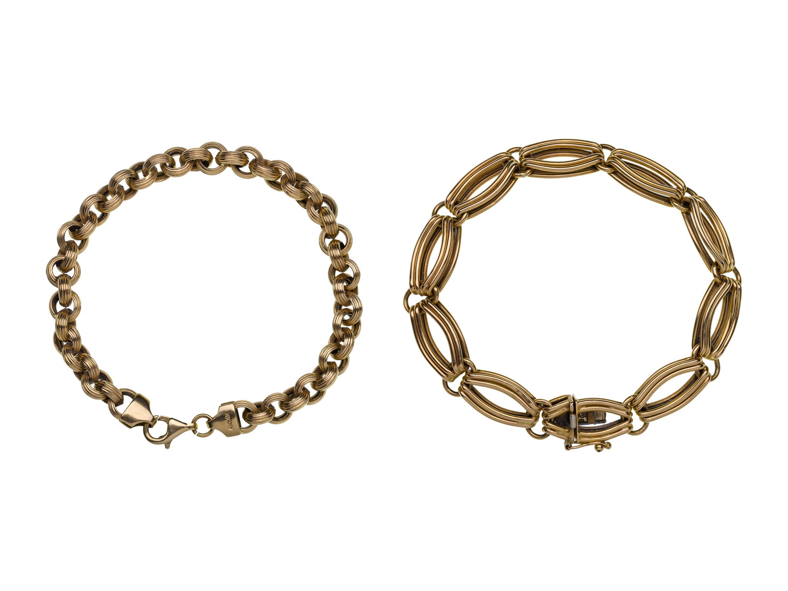 14k Yellow Gold Bracelets: 14k Yellow Gold Bracelets (2) items including a 0.375-inch wide modernist style link as well as a rolo style link (both marked '14k') Property from: a Private Collector, Westmont, Illinois Length: 7