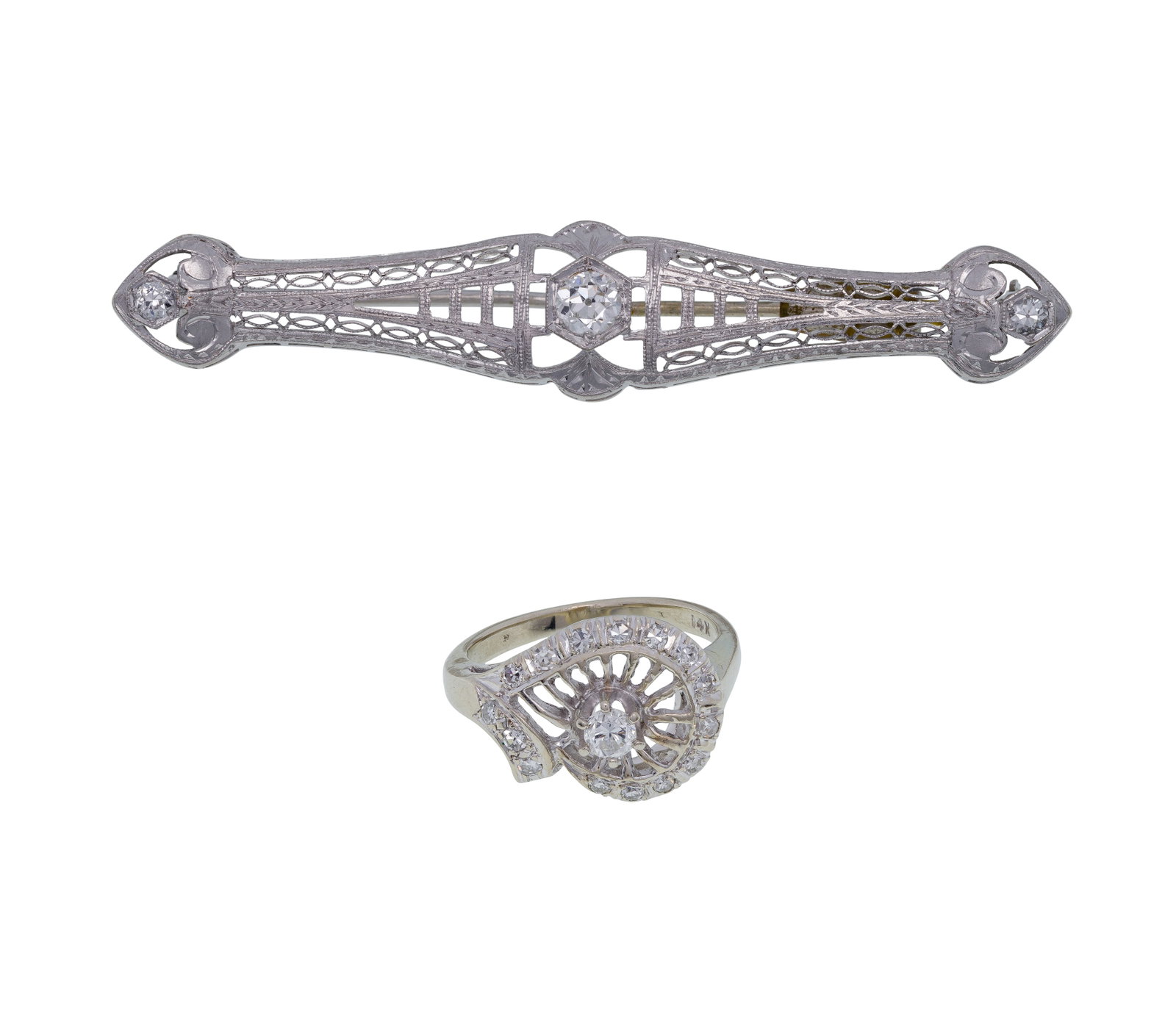 14k White Gold and Diamond Brooch and Ring: 14k White Gold and Diamond Brooch and Ring (2) items having round cut diamonds (marked '14k') Property from: an Estate, Wilmette, Illinois Length: 2 3/8 inches (brooch) Size: ring, 5 Weight: 14k