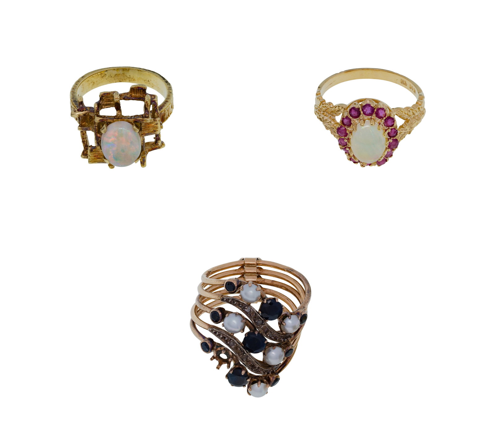 14k Yellow Gold and Gemstone Ring Assortment: 14k Yellow Gold and Gemstone Ring Assortment (3) items including an oval cut opal in a modernist setting, an oval cut opal surround by ruby accents (both marked '14k') as well as a stacked ring