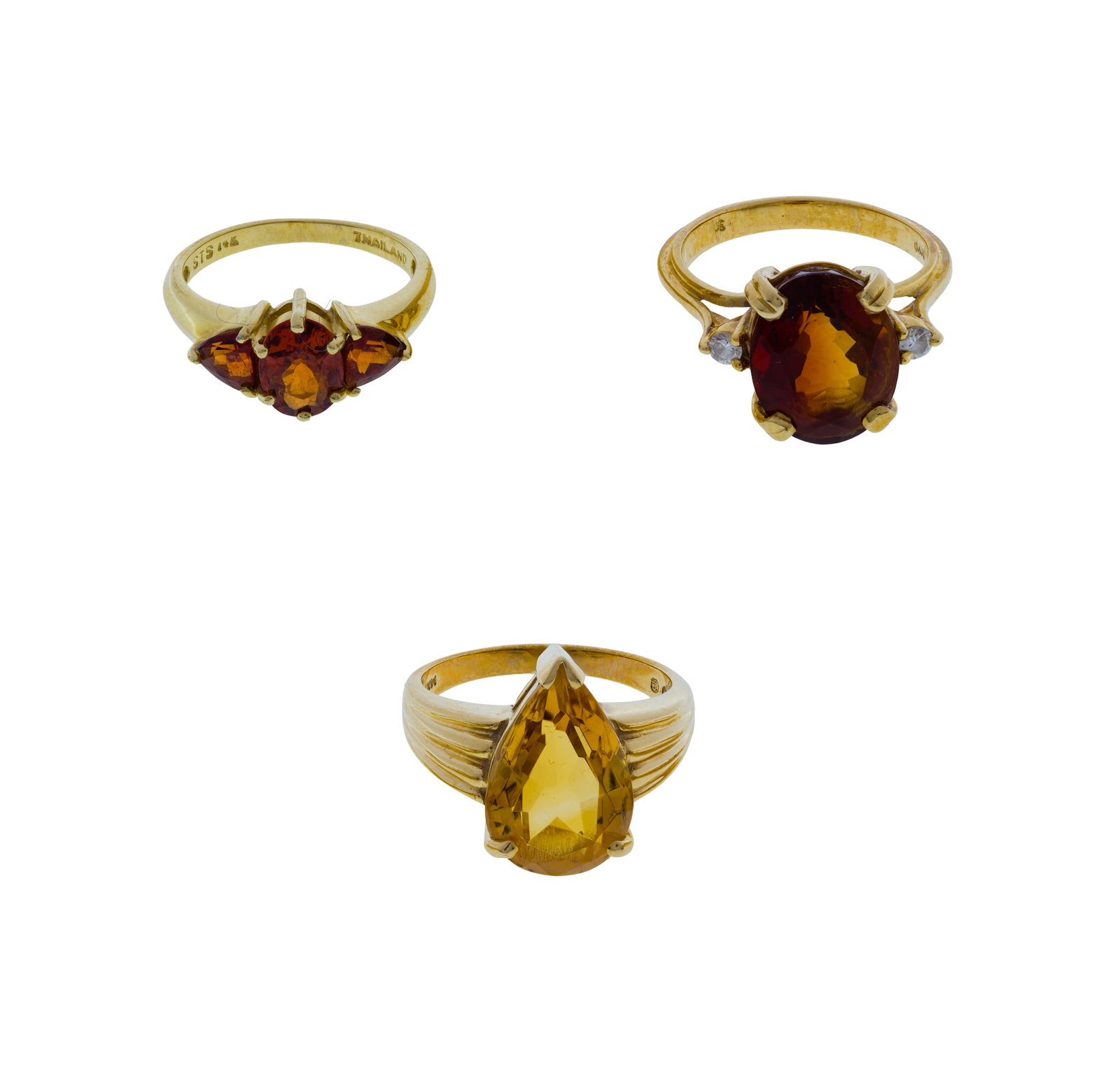 14k Yellow Gold and Gemstone Ring Assortment: 14k Yellow Gold and Gemstone Ring Assortment (3) items including an approximately 15mm x 10mm pear cut citrine, an approximately 12mm x 9mm oval cut garnet flanked by diamond accents and a center