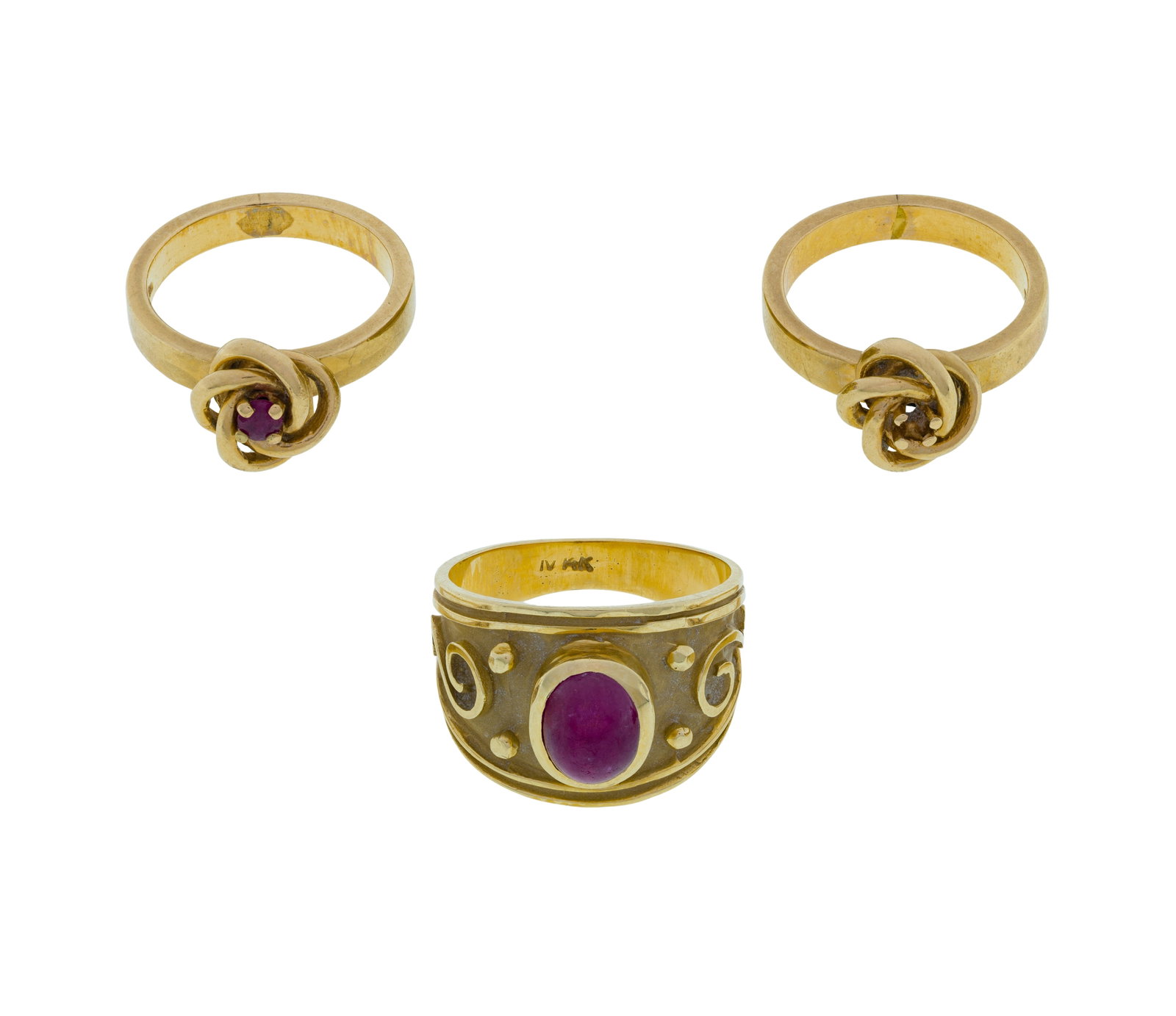 14k Yellow Gold and Ruby Ring Assortment: 14k Yellow Gold and Ruby Ring Assortment (3) items including a cabochon ruby on a wide band and (2) bands having wire knot settings with one having a round cut ruby (all marked '14k') Property from: