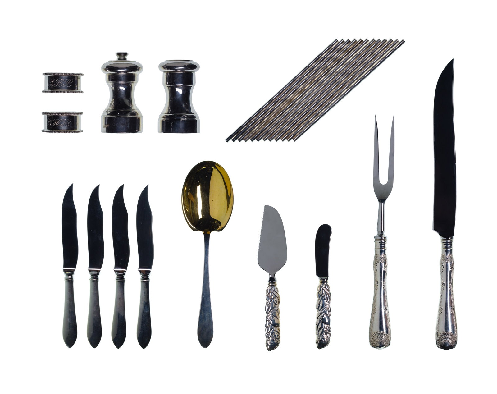 Tiffany & Co Sterling Silver Tableware Assortment: Tiffany & Co Sterling Silver Tableware Assortment (25) items including a set of twelve straws, a 2-piece cheese serving set, a gold-wash serving spoon, a set of (2) napkin rings, a set of (4) fish