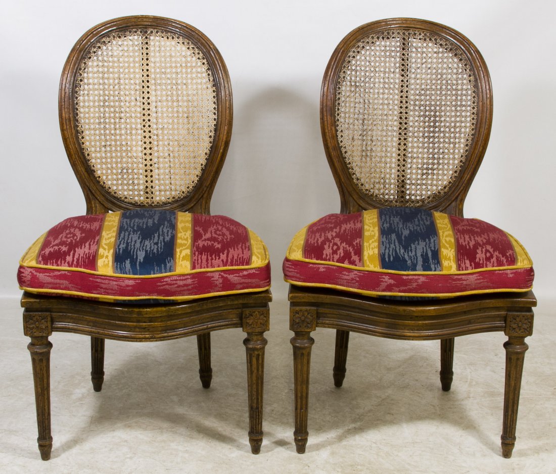 Sheraton Style Walnut Side Chairs: Sheraton Style Walnut Side Chairs Two chairs having cane seats and backs, fluted pillar legs and custom made seat cushions Height: 36.00 inches, Width: 21.00 inches, Depth: 19.00 inches Category: Furn