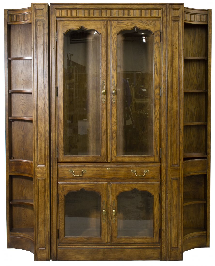 Chatham Oak Wall Unit by Drexel: Chatham Oak Wall Unit by Drexel Three pieces, includes center cabinet with wood-framed glass doors flanked by curved shelve units Height: 80.00 inches, Width: 69.00 inches, Depth: 16.00 inches Categor