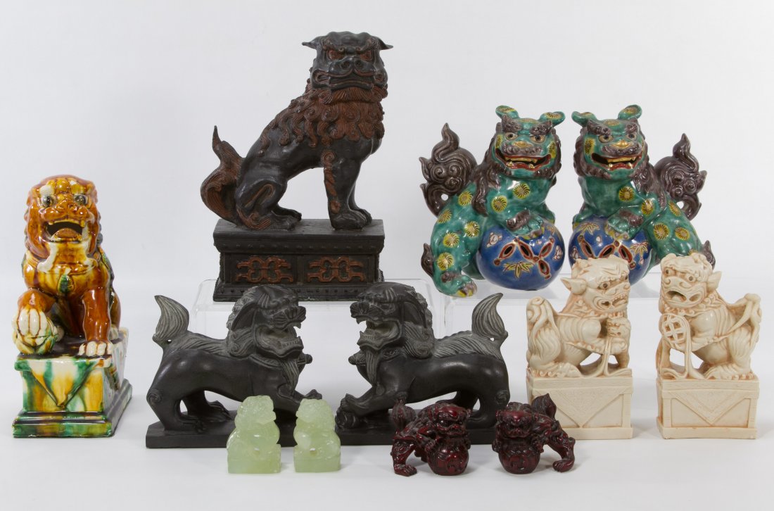 Asian Fu Dog Collection: Asian Fu Dog Collection Five matching pair and two individual. (1) jadeite pair, (1) red wooden pair (possibly cinnabar), (1) ceramic pair, (1) ceramic single piece, (1) soap stone pair, (1) black met
