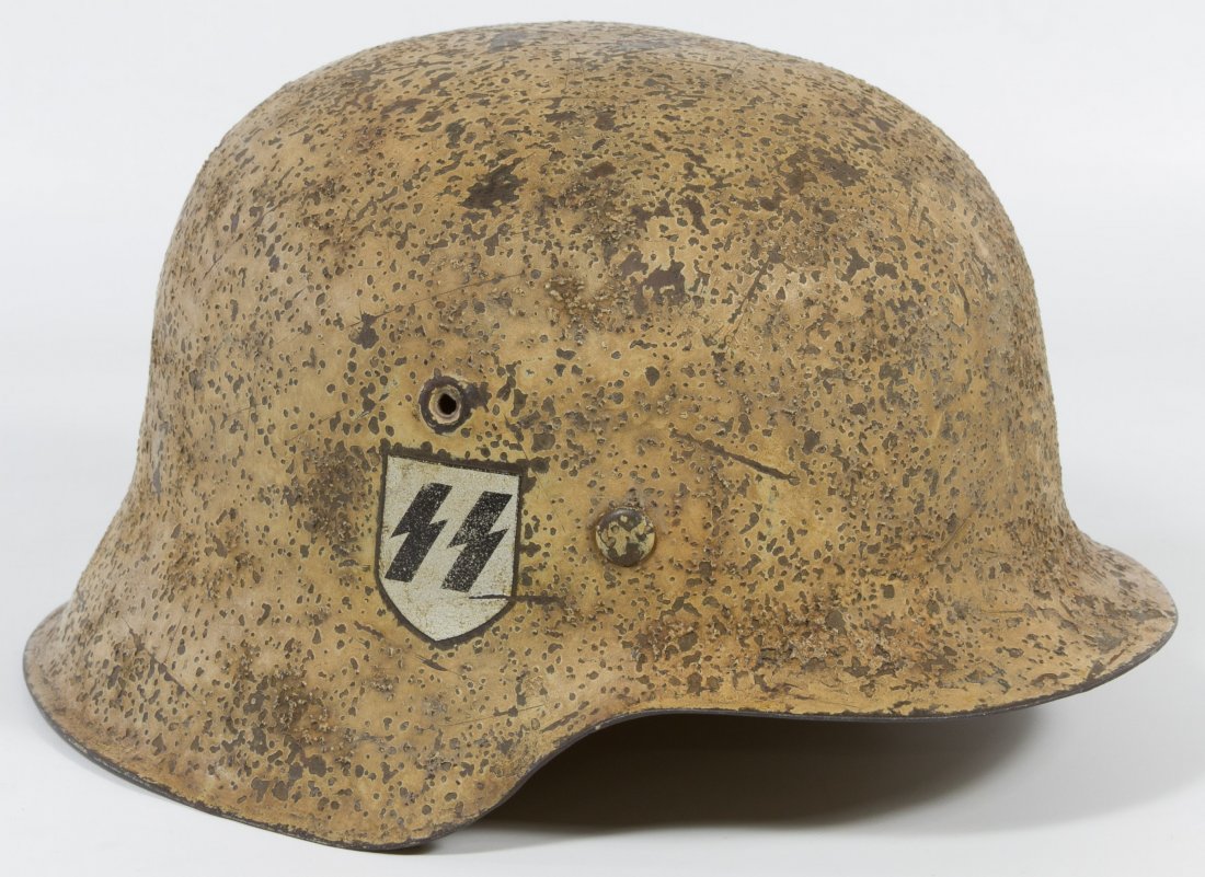 World War II German SS M42 Helmet: World War II German SS M42 Helmet Mediterranean (African Core) theater, full liner, partial chin strap, and camouflage paint Category: Military & Weapons > World War II Shipping Status: Leonard Auctio