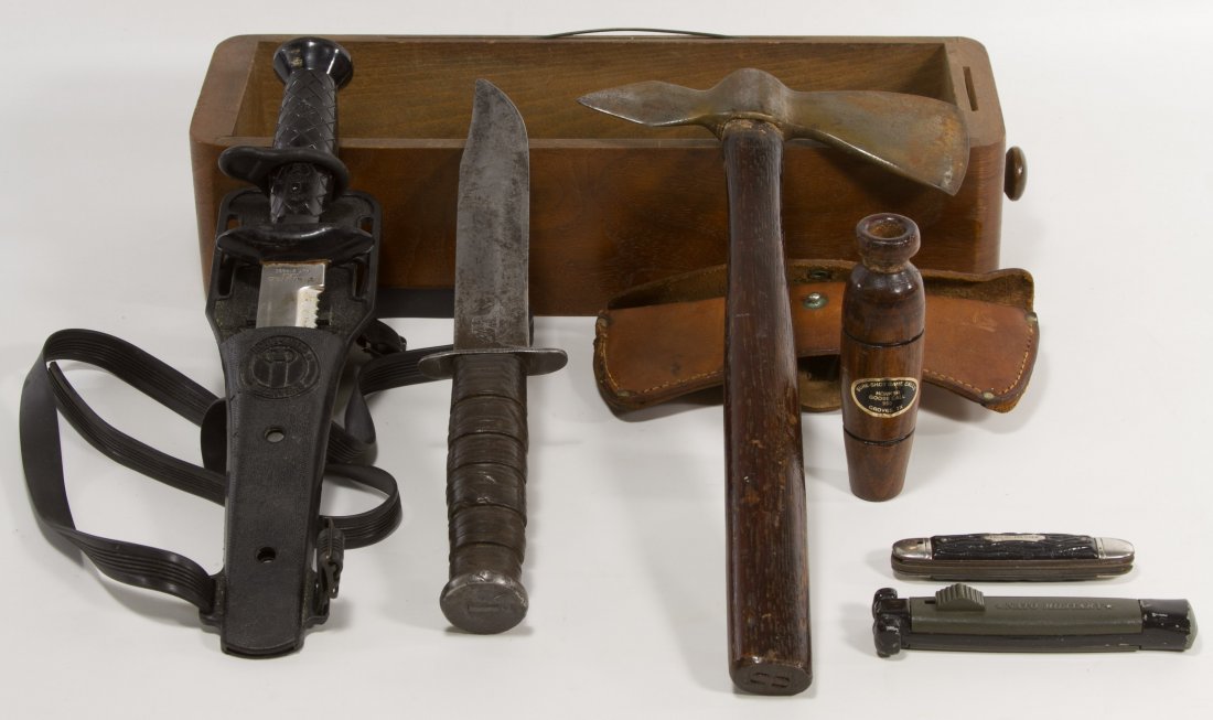 Knife Assortment and Duck Call: Knife Assortment and Duck Call Six items: (1) duck call, (1) vintage axe, (1) NATO knife handle, (1) First-Master pocket knife, (1) USMC knife, and (1) 'aqua-lung' knife Width: 13.50 inches (axe) Cate
