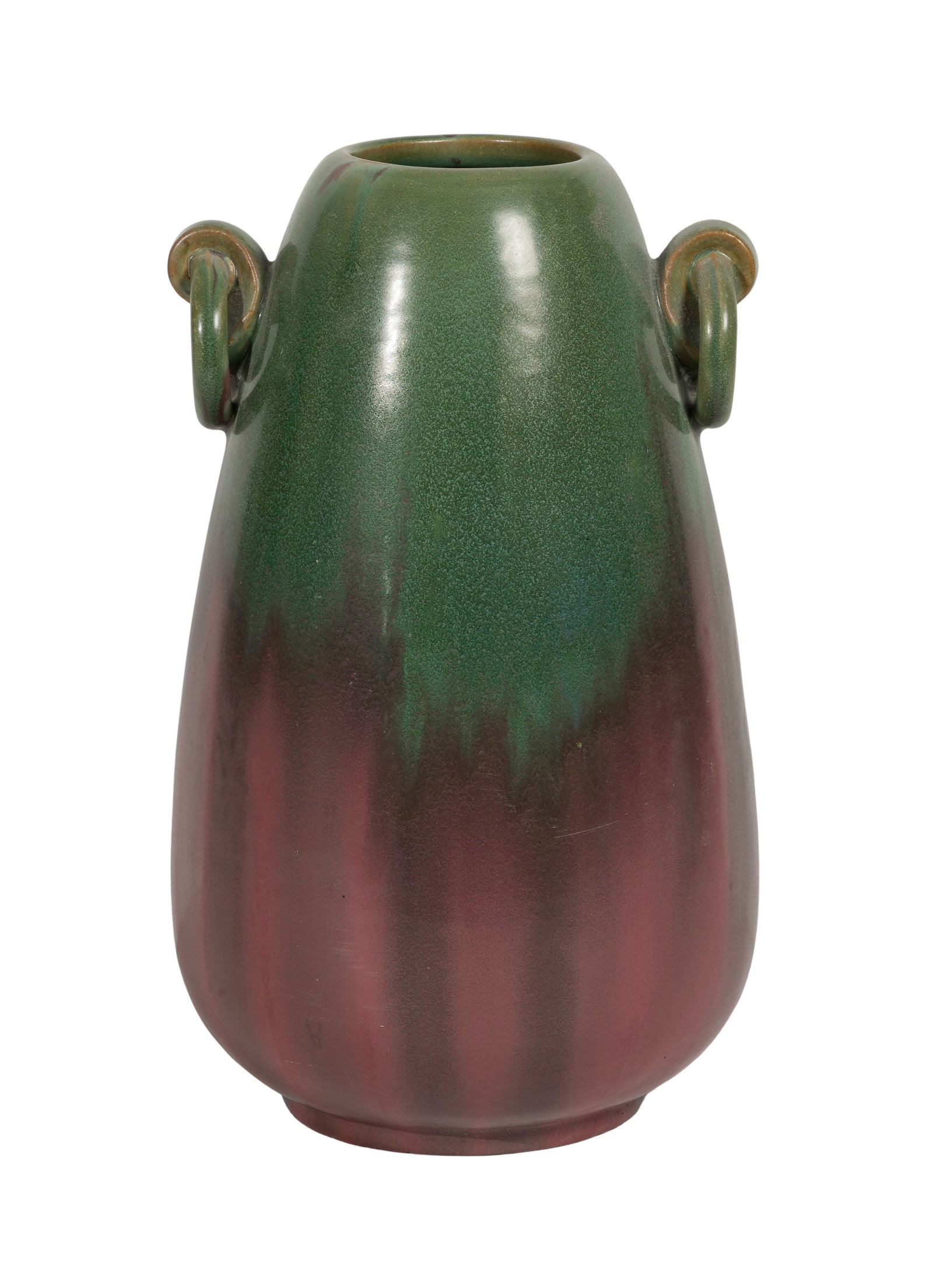 Fulper Pottery Vase: Fulper Pottery Vase Glaze transitioning from green to dusty rose, two applied handles, rectangular stamped mark to underside Property from: an Estate, Glen Ellyn, Illinois Height: 13 inches, Width: 8