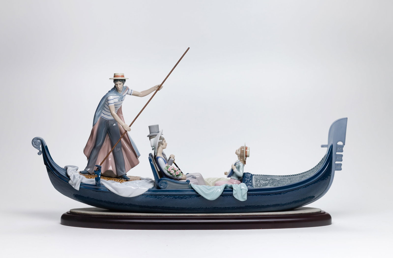 Lladro #1350 In The Gondola Porcelain Figural Group: Lladro #1350 In The Gondola Porcelain Figural Group Having base, #1350 and signed on underside, sculpted by Francisco Catala, decorated by Julio Ruiz Property from: a Private Collector, Barrington,