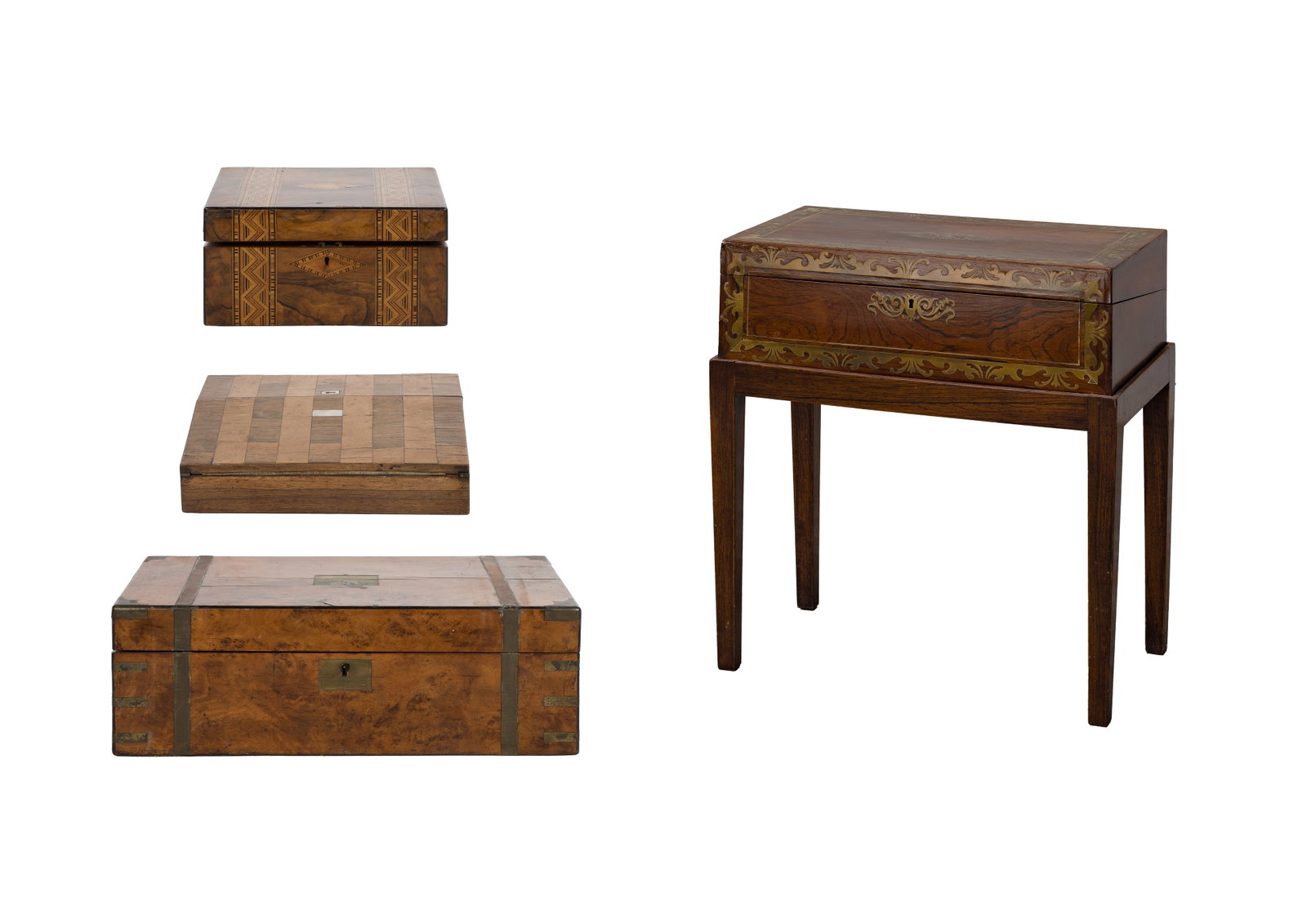 Lap Desk Assortment: Lap Desk Assortment (4) items having various wood veneers, inlays, brass accents, a sloped writing surface having a felt writing pad, interiors having varying configurations of fitted stationery