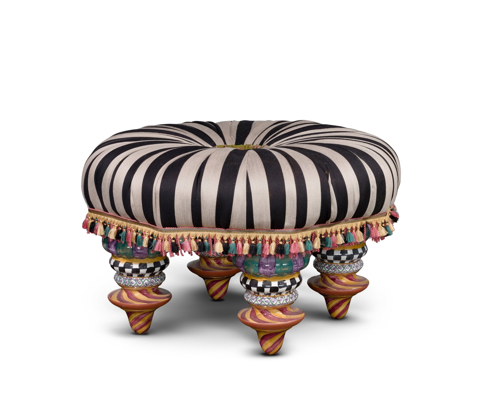 MacKenzie-Childs On Wall Street Ottoman: MacKenzie-Childs On Wall Street Ottoman Upholstered in black and beige striped jacquard fabric having a button covered in Gordonstown tartan, an iridescent purple and green moiré pleated ruff and a