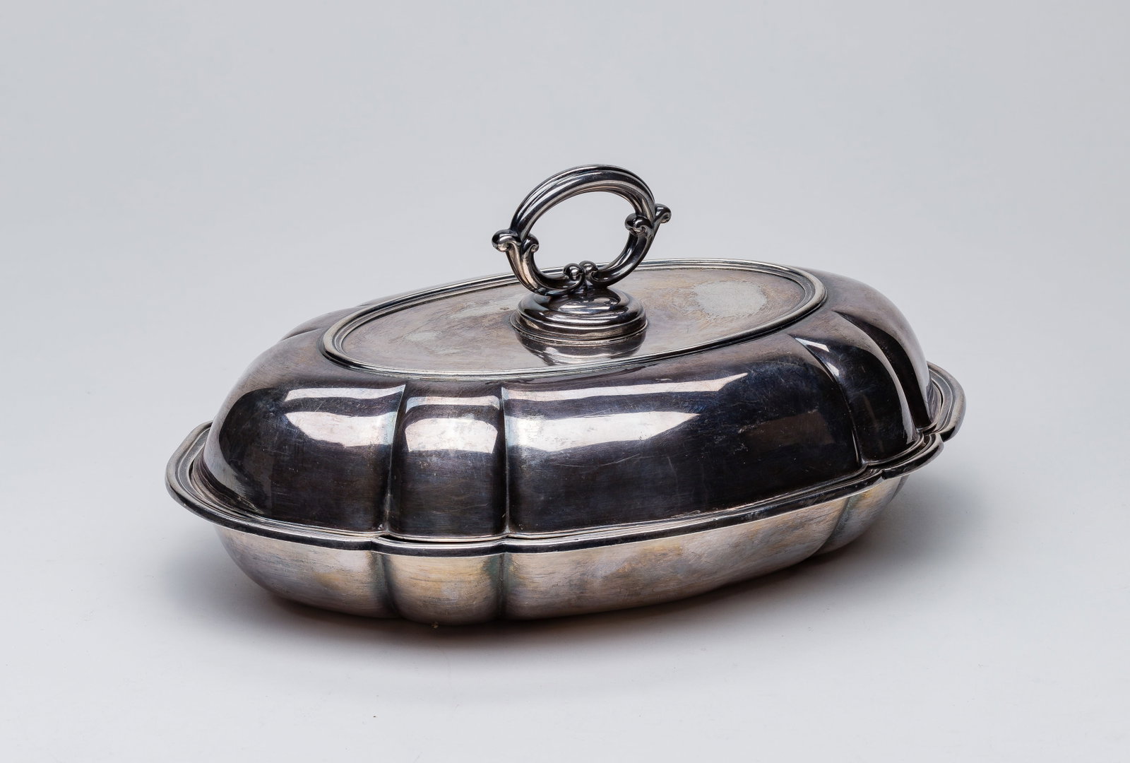 Danish Sterling Silver: Danish Sterling Silver An oval lidded serving dish having twist and lock handle for using lid as a separate dish (all having Danish hallmarks) Property from: an Estate, Verona, Wisconsin Height: 5