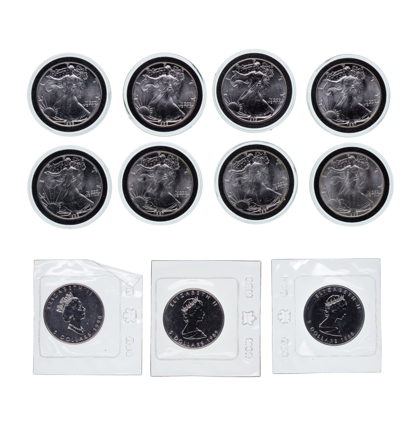 US $1 and Canada $5 Silver Coin Assortment: US $1 and Canada $5 Silver Coin Assortment (11) coins including (8) Silver Eagles and (3) Maple Leaf, all fine silver (0.999) Property from: a Private Collector, River Grove, Illinois Category:
